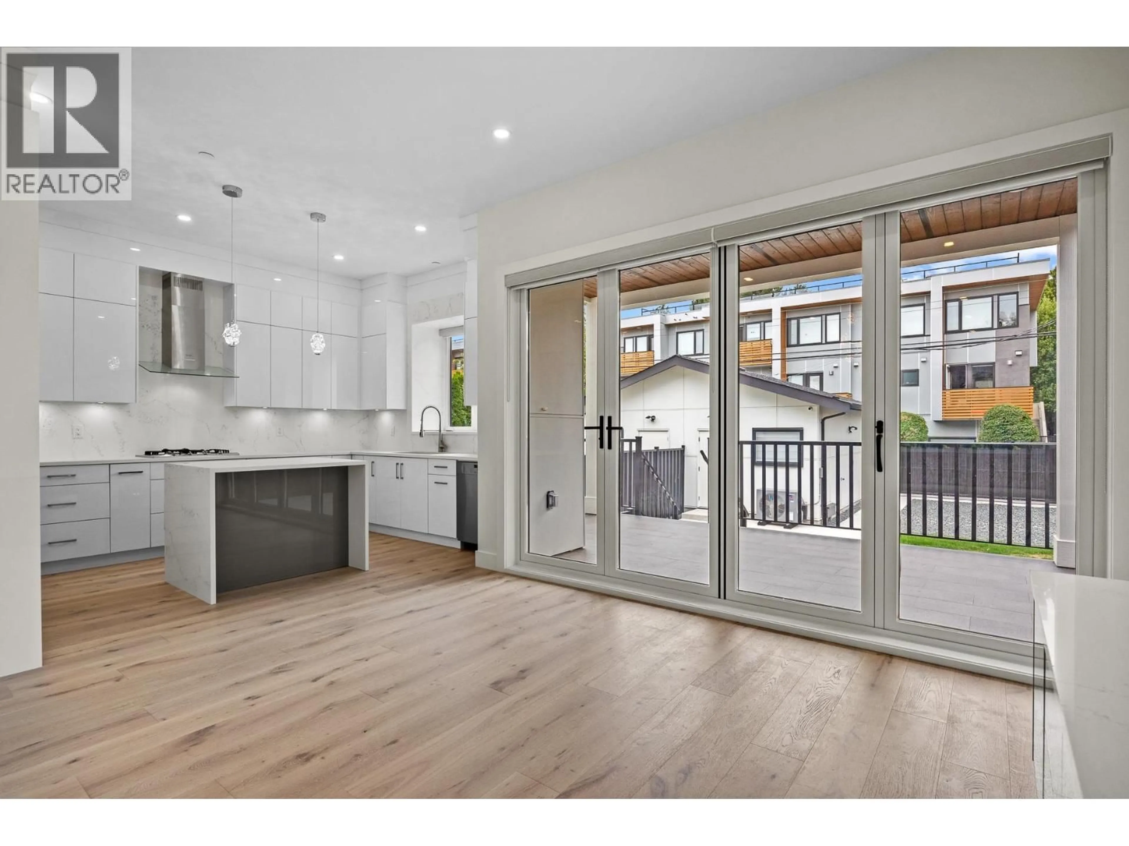 Open concept kitchen, wood/laminate floor for 6009 FREMLIN STREET, Vancouver British Columbia V5Z3W8