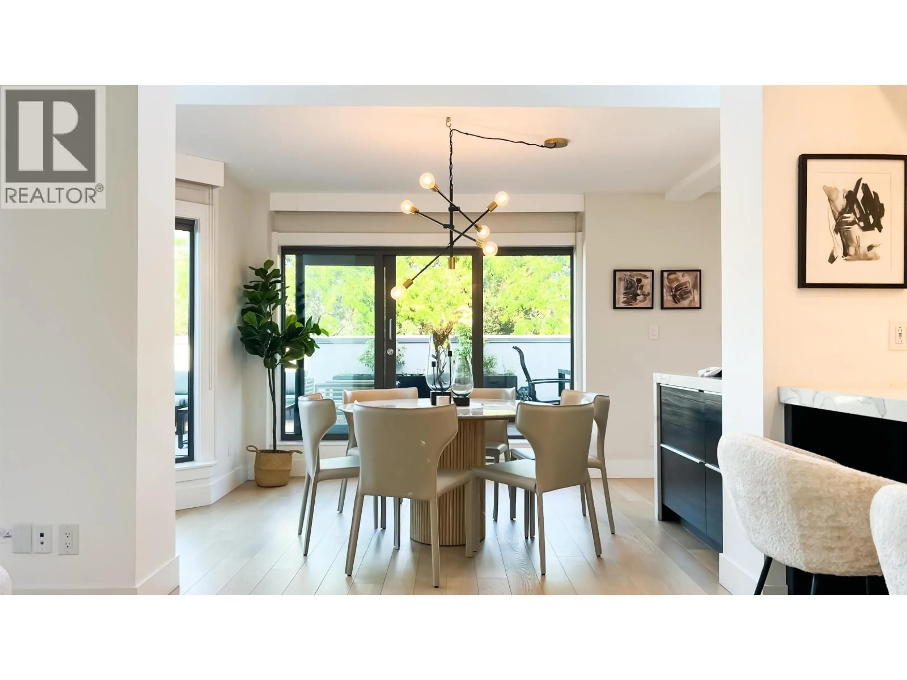 Dining room, wood/laminate floor for 408 - 1477 FOUNTAIN WAY, Vancouver British Columbia V6H3W9