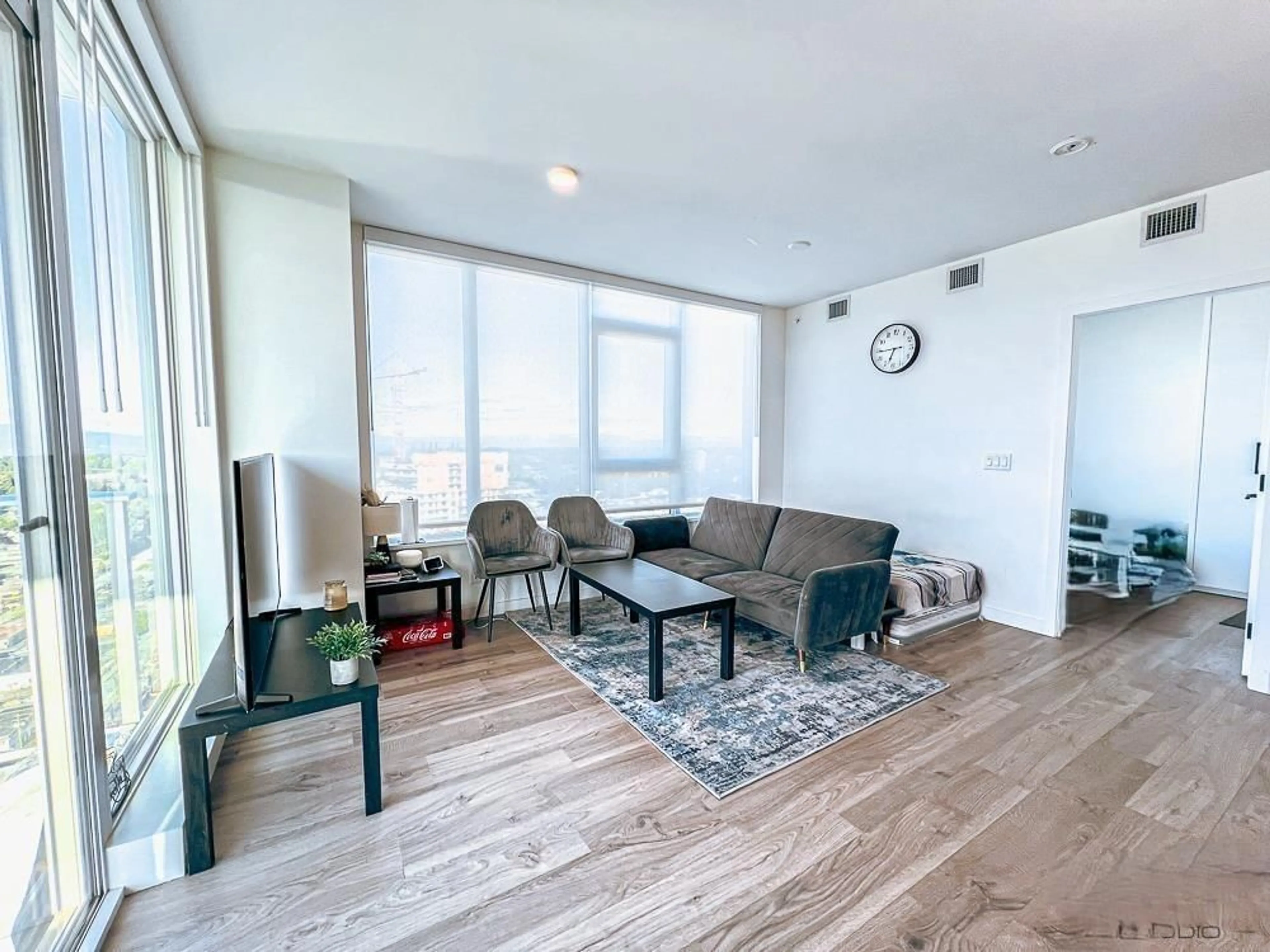 Living room with furniture, wood/laminate floor for 3104 - 10448 UNIVERSITY, Surrey British Columbia V3T0S7