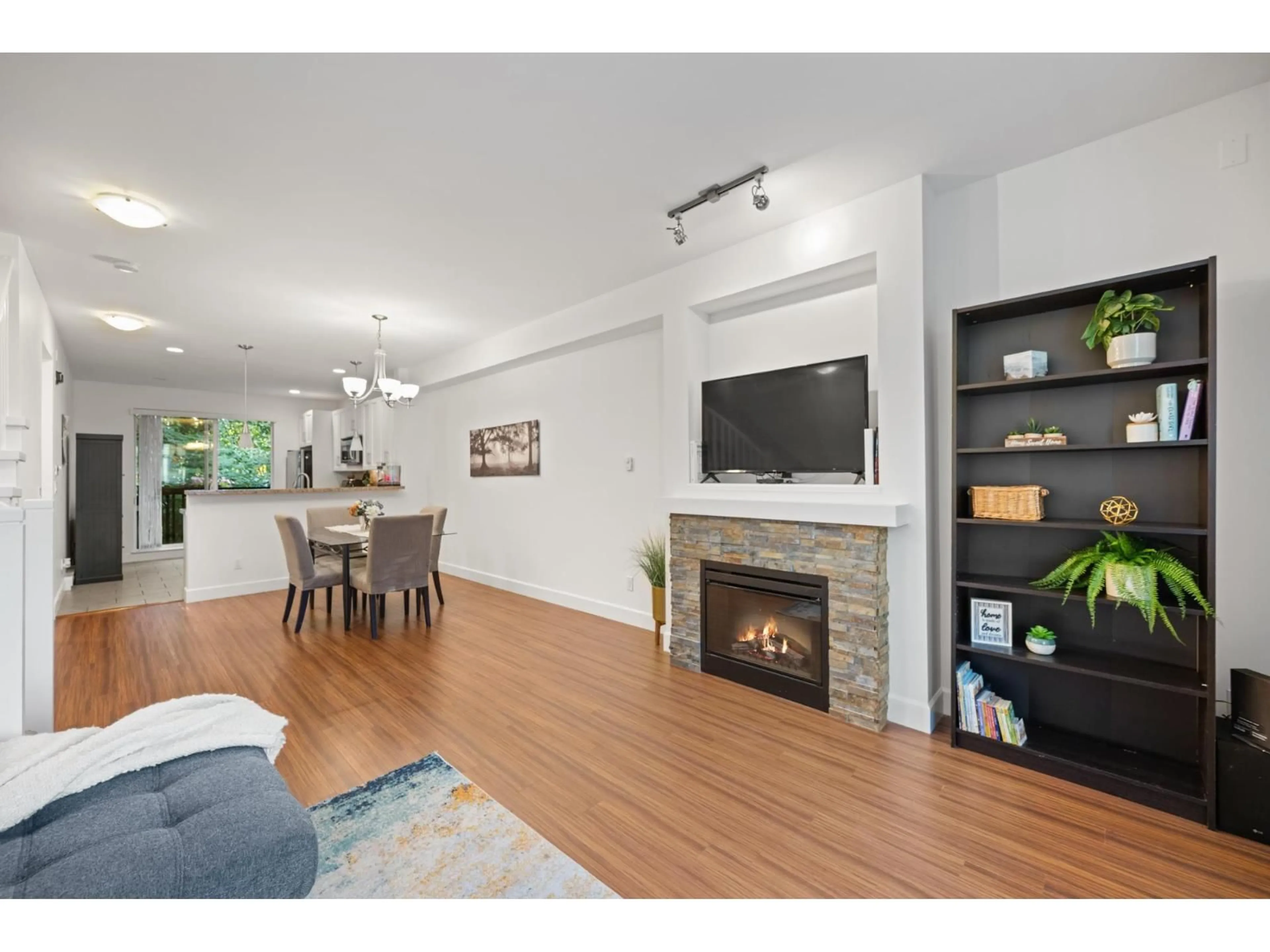 Living room with furniture, wood/laminate floor for 101 - 2979 156, Surrey British Columbia V3Z8V8