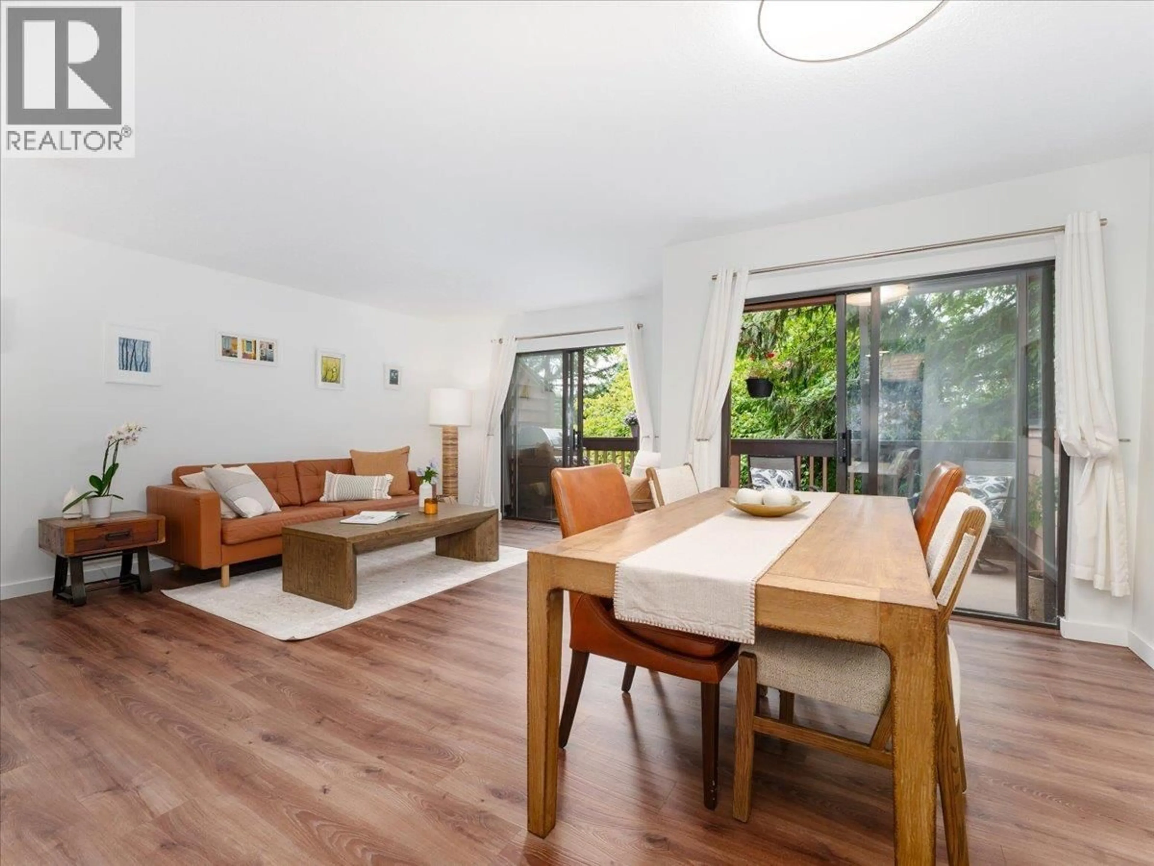 Living room with furniture, wood/laminate floor for 402 CARDIFF WAY, Port Moody British Columbia V3H3T1