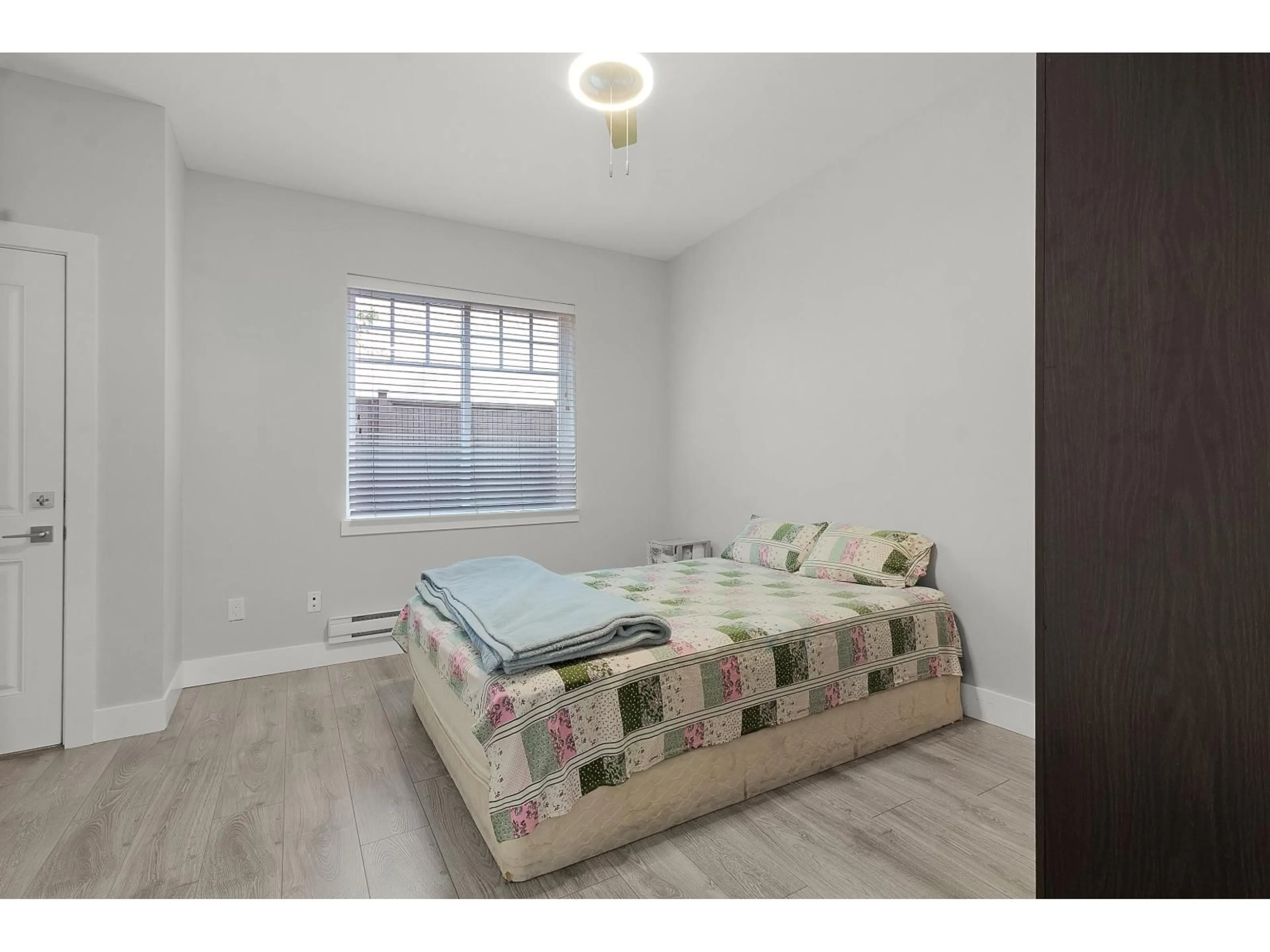 Bedroom with bed, wood/laminate floor for 23 - 2530 JANZEN, Abbotsford British Columbia V2T0H7