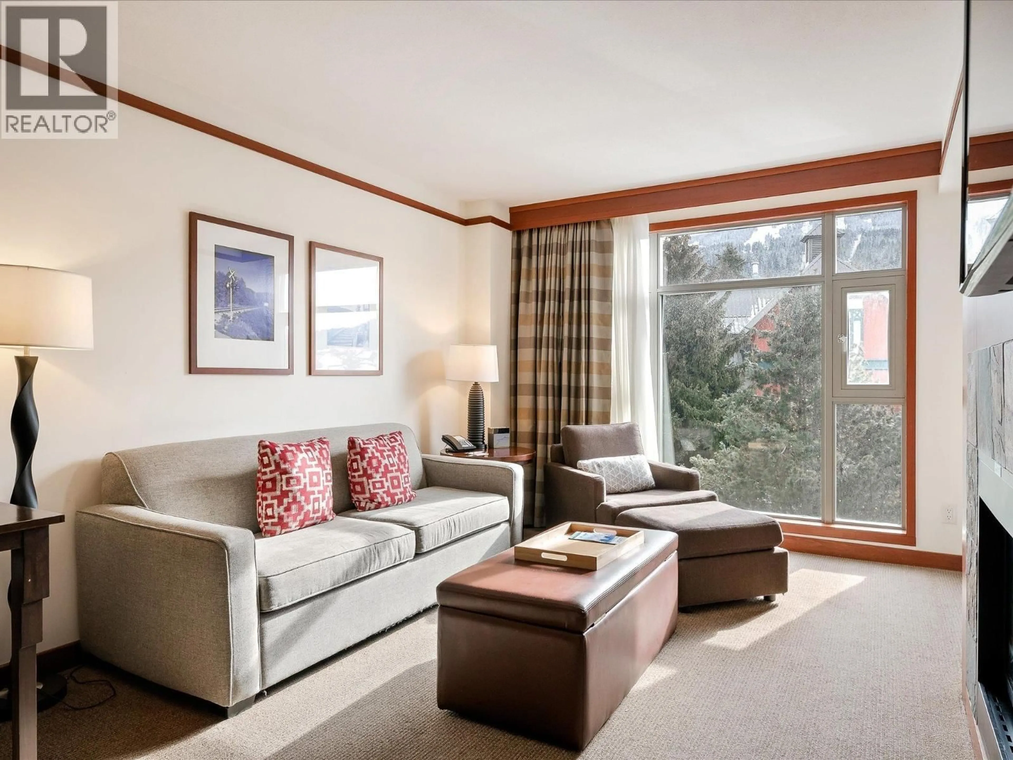 Living room with furniture, wood/laminate floor for 4417 - 4299 BLACKCOMB WAY, Whistler British Columbia V8E0X3
