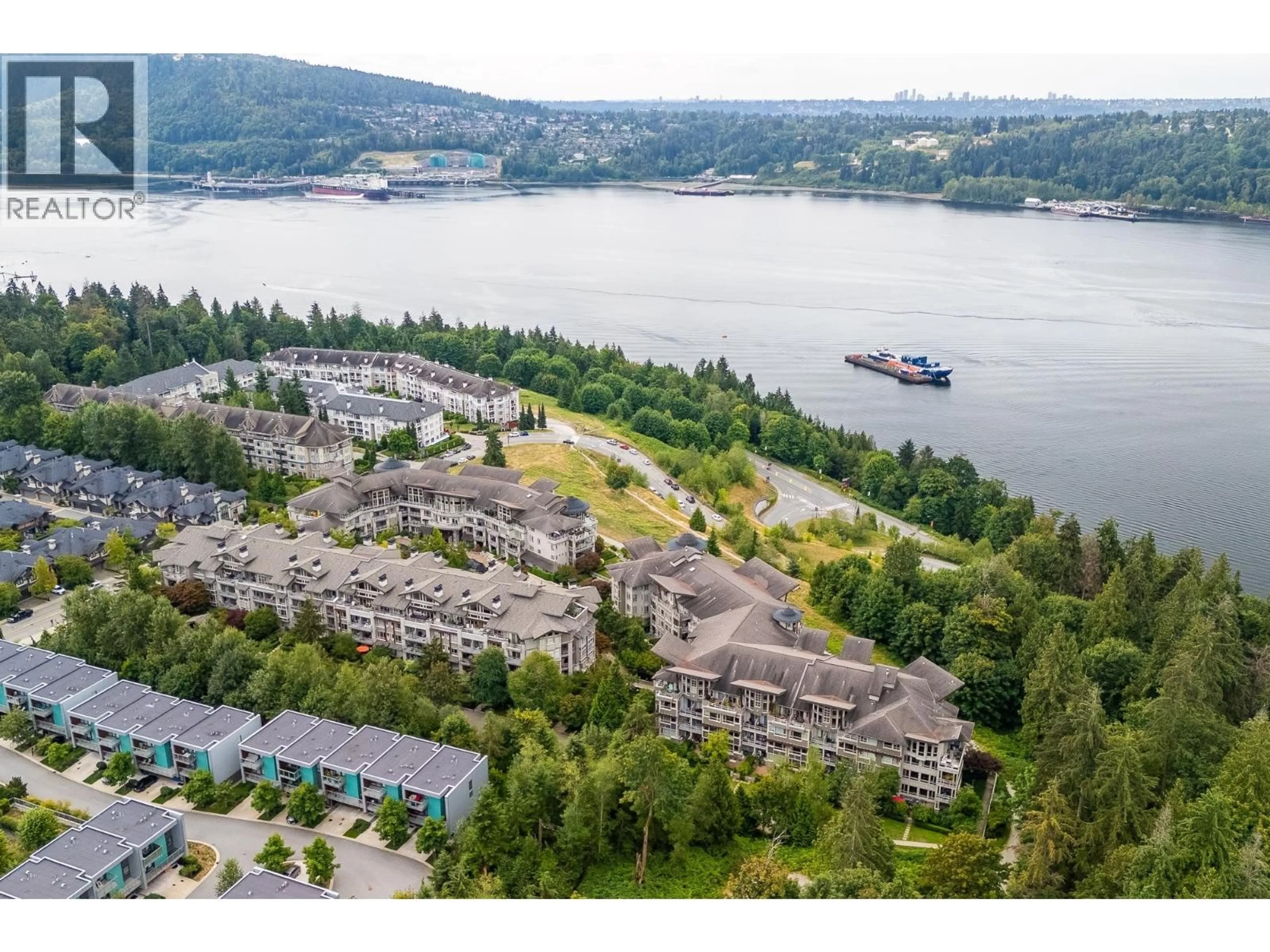 A pic from outside/outdoor area/front of a property/back of a property/a pic from drone, water/lake/river/ocean view for 301 - 560 RAVEN WOODS DRIVE, North Vancouver British Columbia V7G2T3