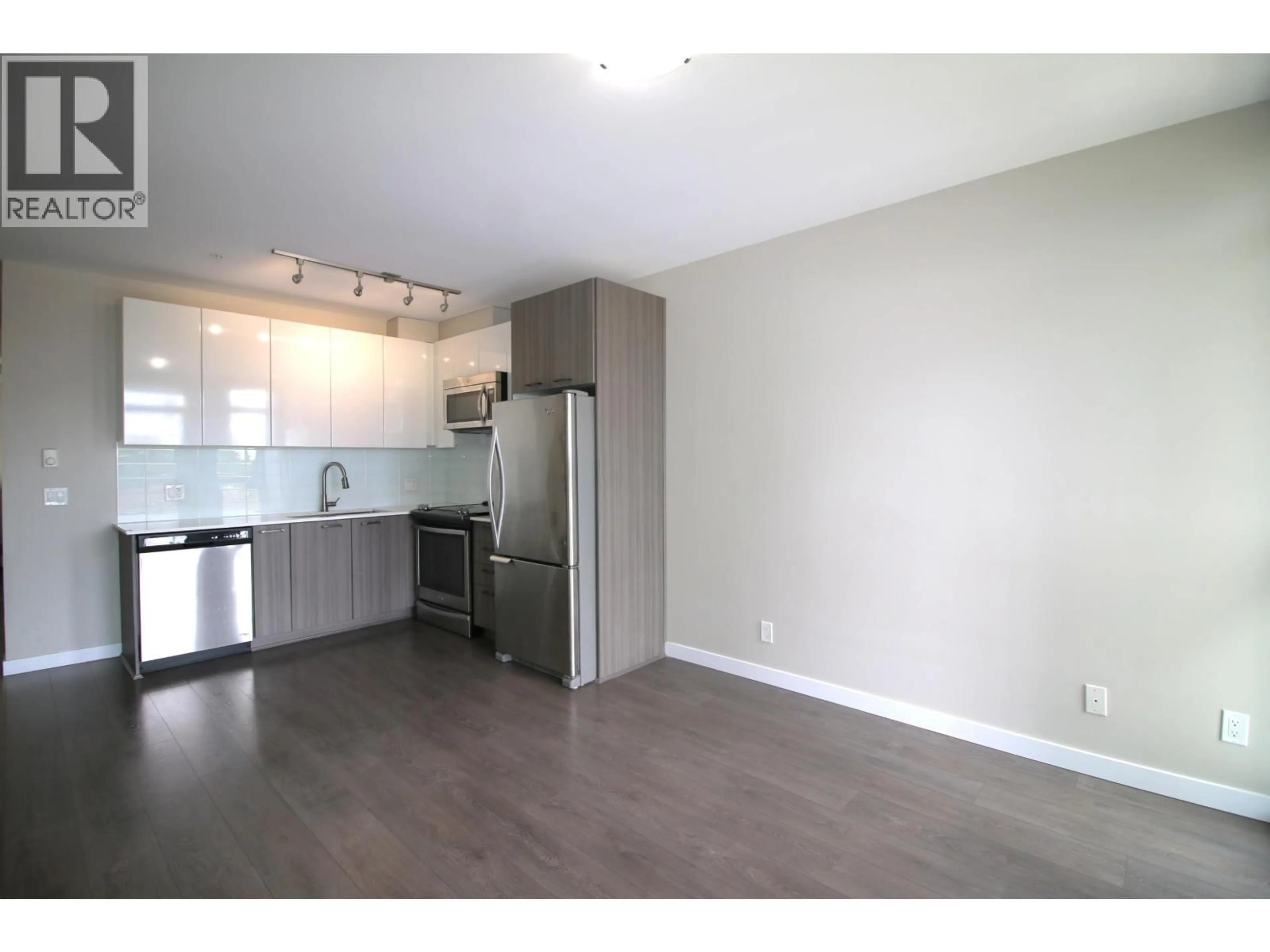 Open concept kitchen, wood/laminate floor for 306 - 6555 VICTORIA DRIVE, Vancouver British Columbia V5P3X8