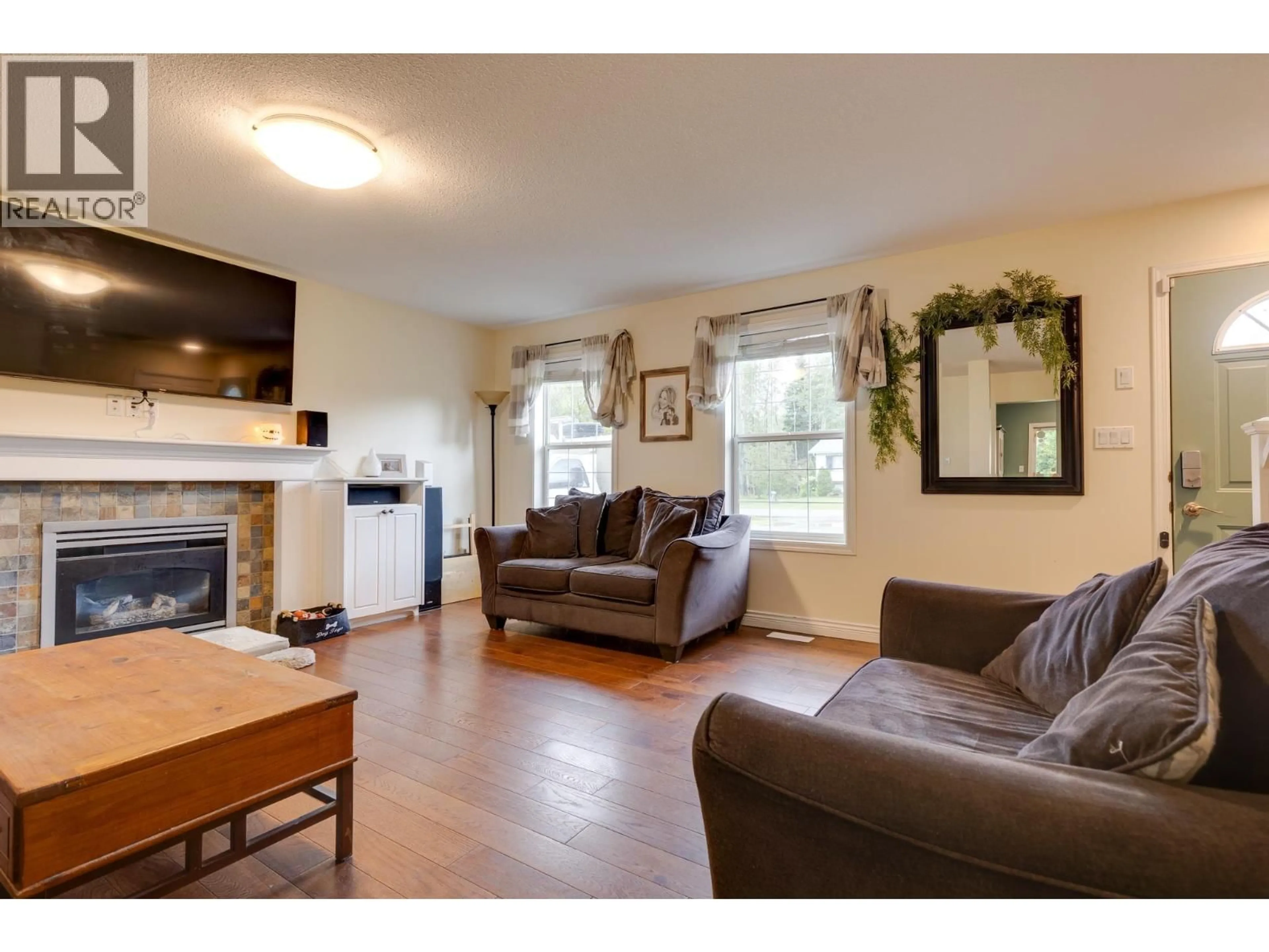 Living room with furniture, wood/laminate floor for 1714 SOMMERVILLE ROAD, Prince George British Columbia V2N6T6
