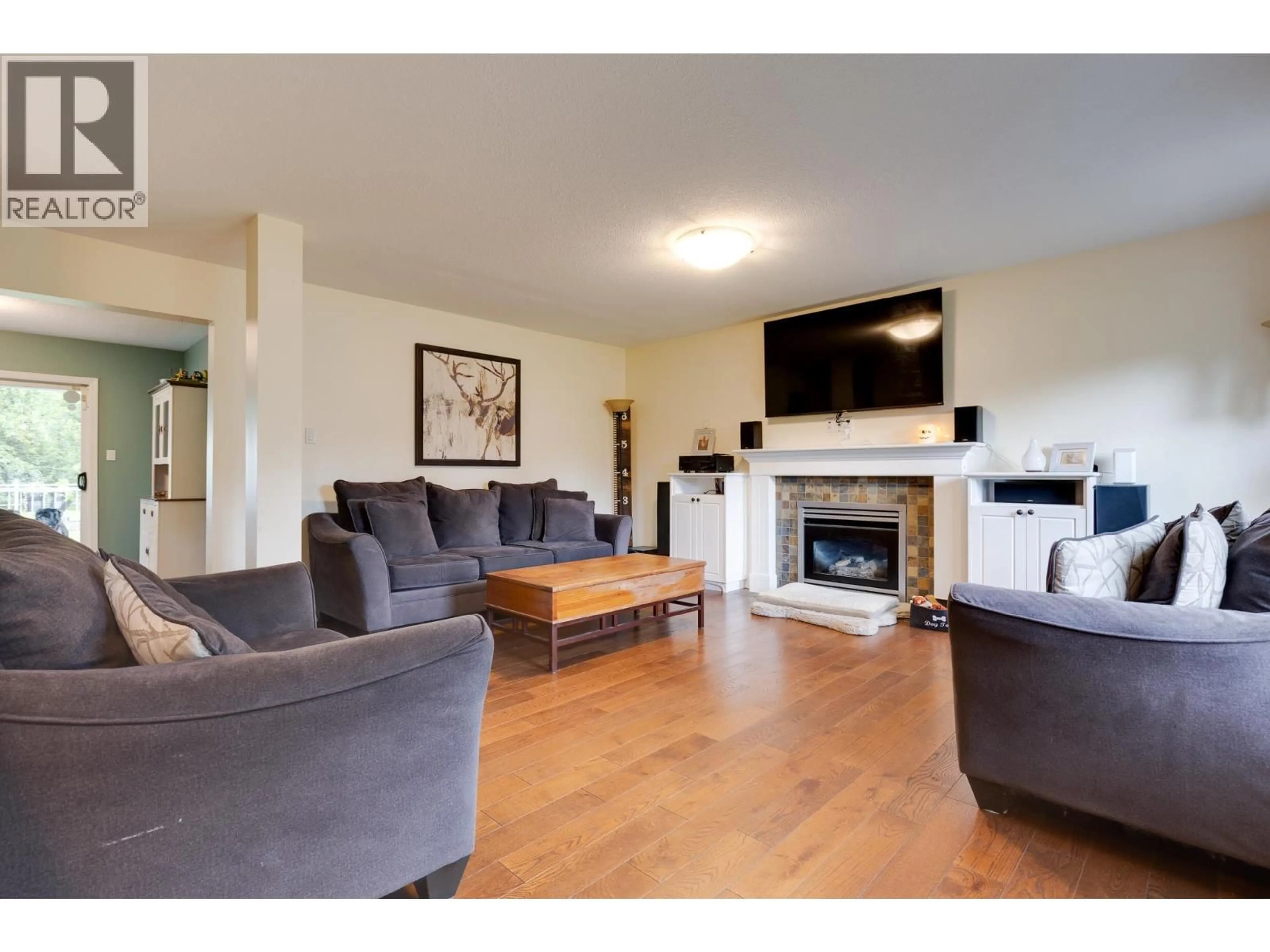 Living room with furniture, wood/laminate floor for 1714 SOMMERVILLE ROAD, Prince George British Columbia V2N6T6
