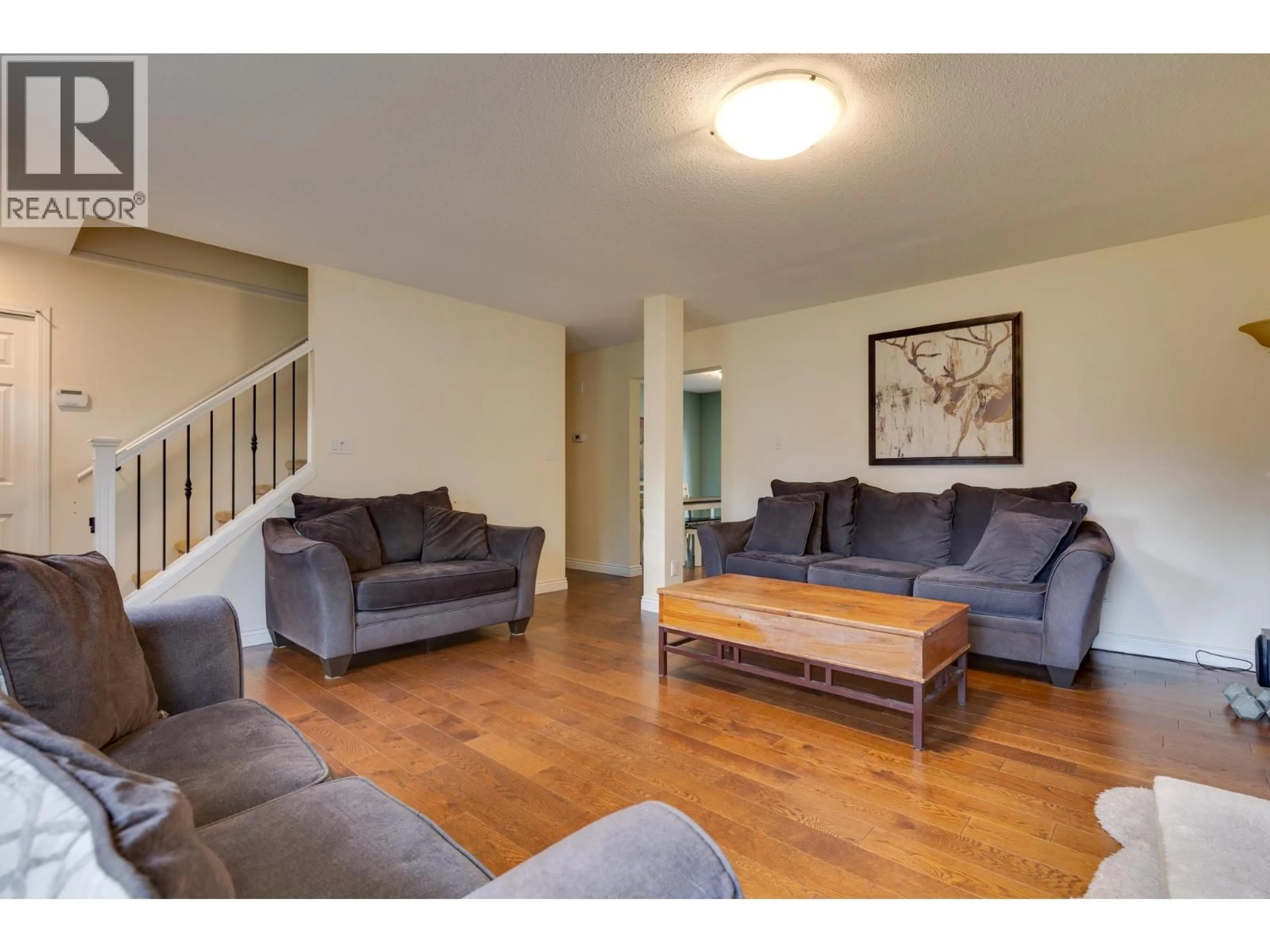 Living room with furniture, wood/laminate floor for 1714 SOMMERVILLE ROAD, Prince George British Columbia V2N6T6