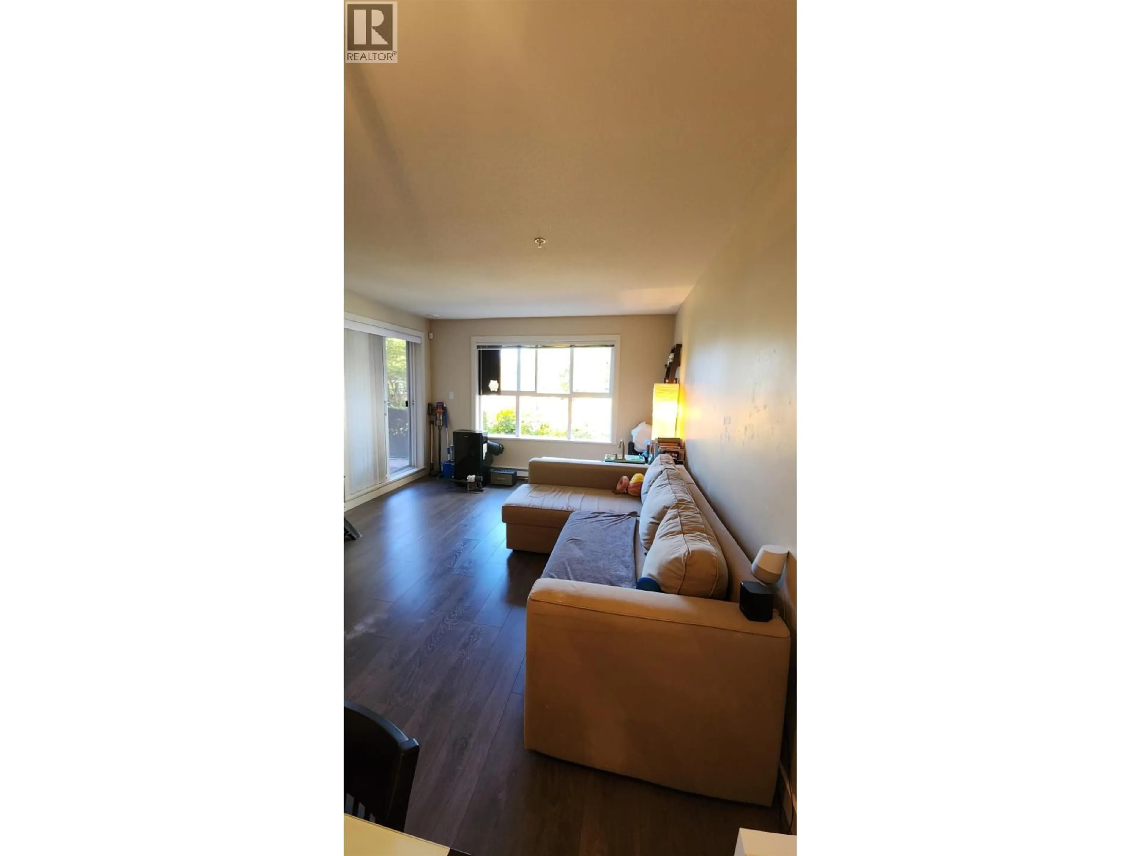 Living room with furniture, wood/laminate floor for 106 - 5889 IRMIN STREET, Burnaby British Columbia V5J0C1
