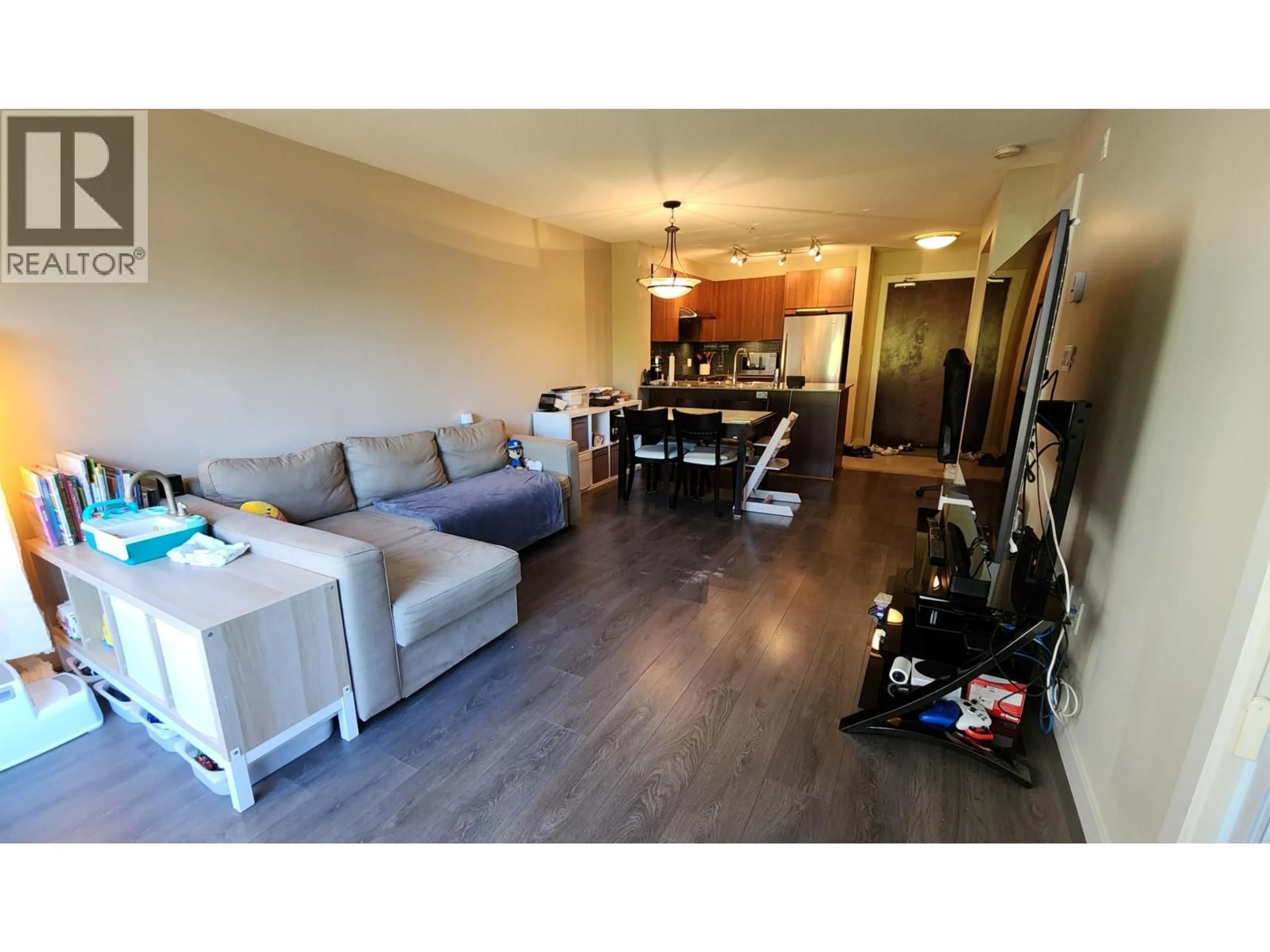 Living room with furniture, wood/laminate floor for 106 - 5889 IRMIN STREET, Burnaby British Columbia V5J0C1