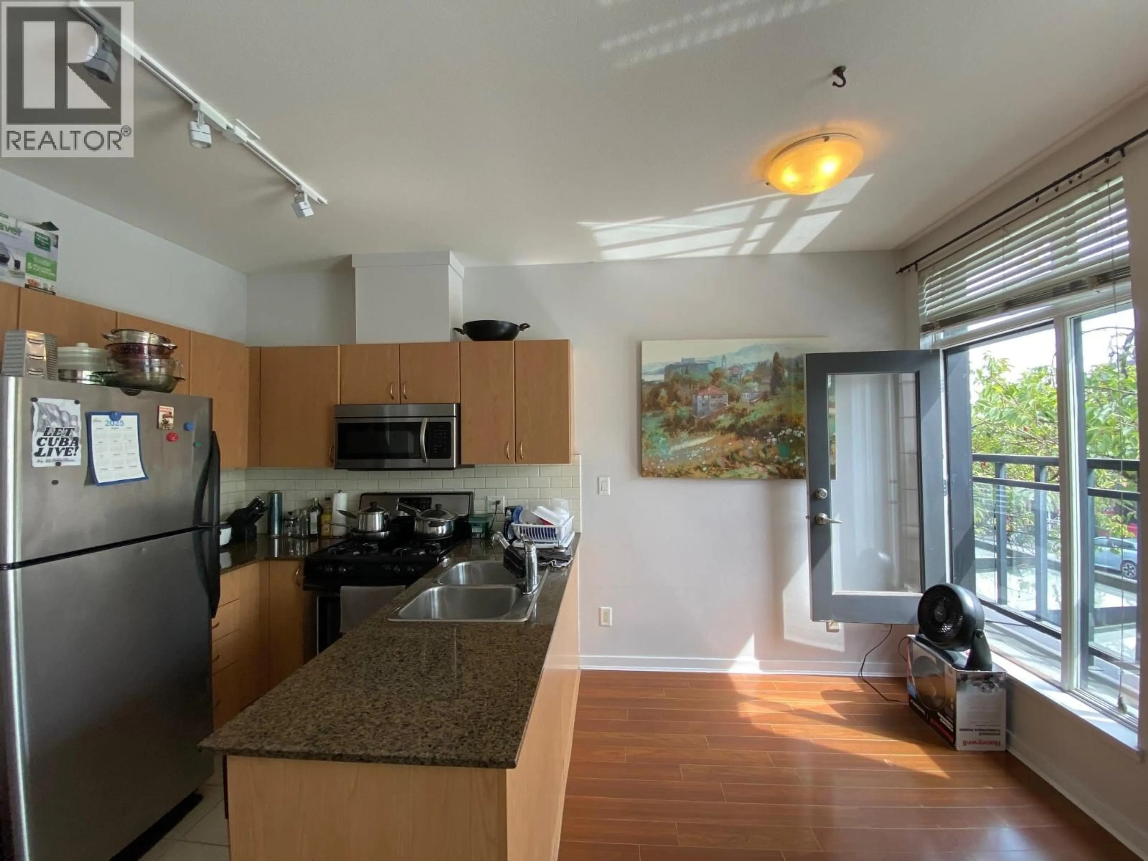 Open concept kitchen, unknown for 202 - 4479 10TH AVENUE, Vancouver British Columbia V6R2H8