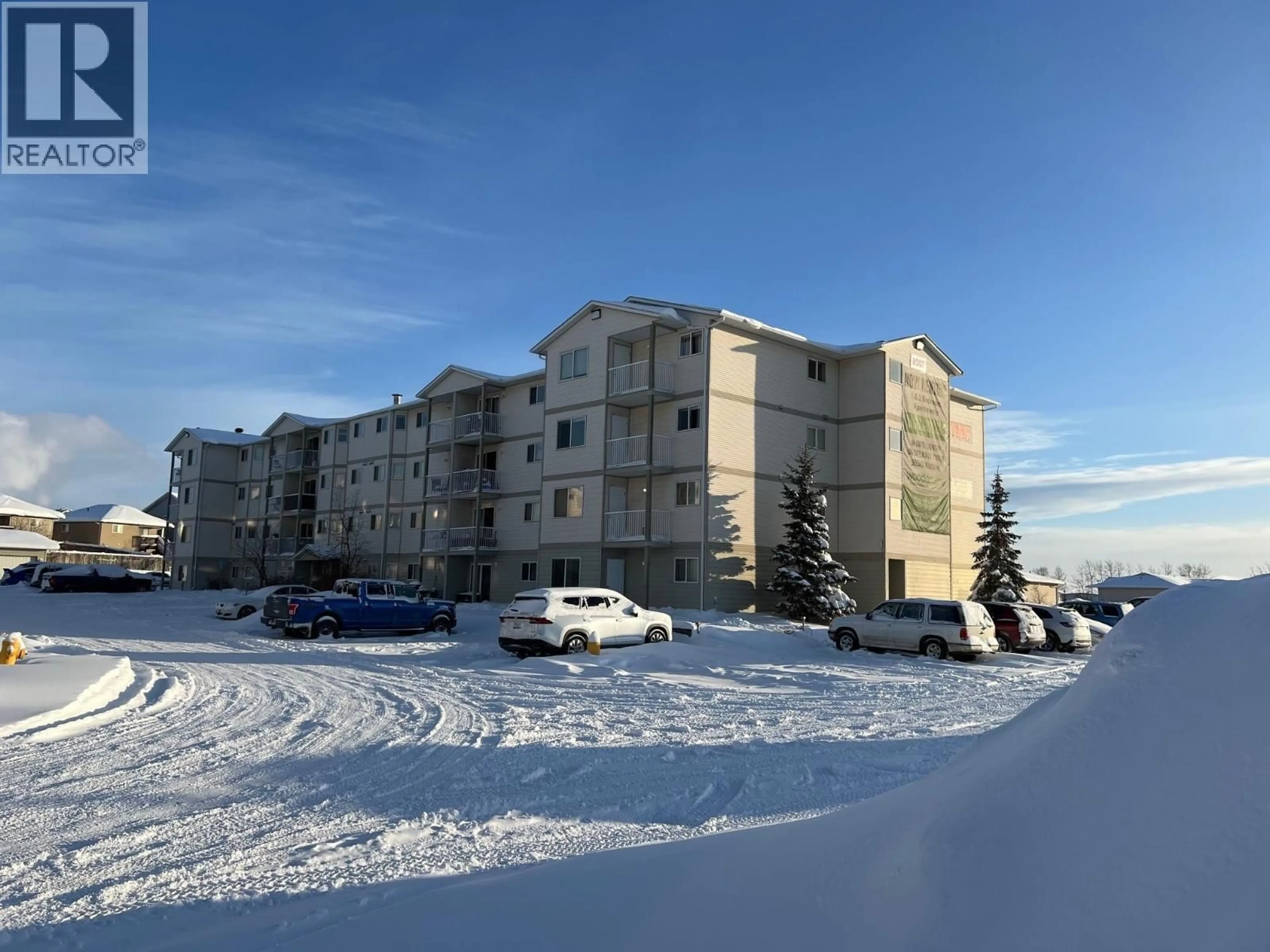 A pic from outside/outdoor area/front of a property/back of a property/a pic from drone, building for 101 - 8507 86 STREET, Fort St. John British Columbia V1J0E4