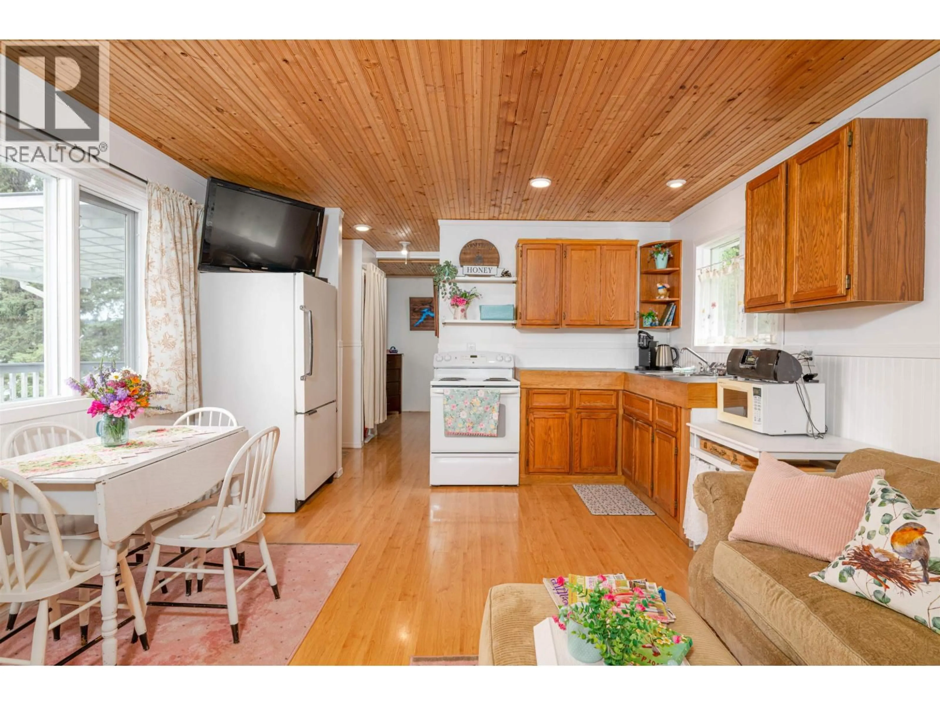 Open concept kitchen, wood/laminate floor for 50490 LLOYD DRIVE, Cluculz Lake British Columbia V0J3A3