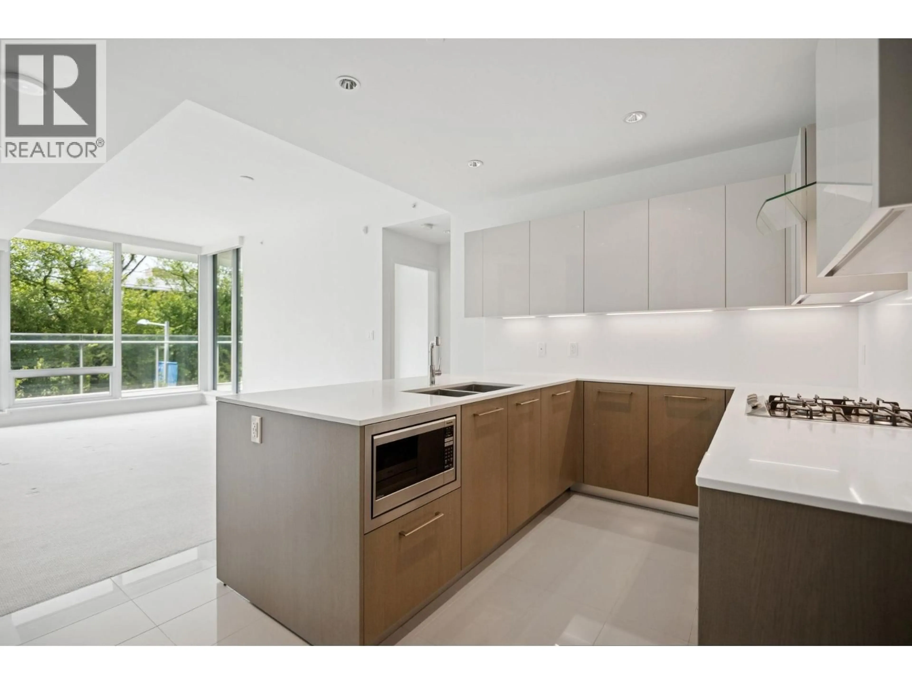 Open concept kitchen, ceramic/tile floor for 206 - 6611 PEARSON WAY, Richmond British Columbia V7C0C3