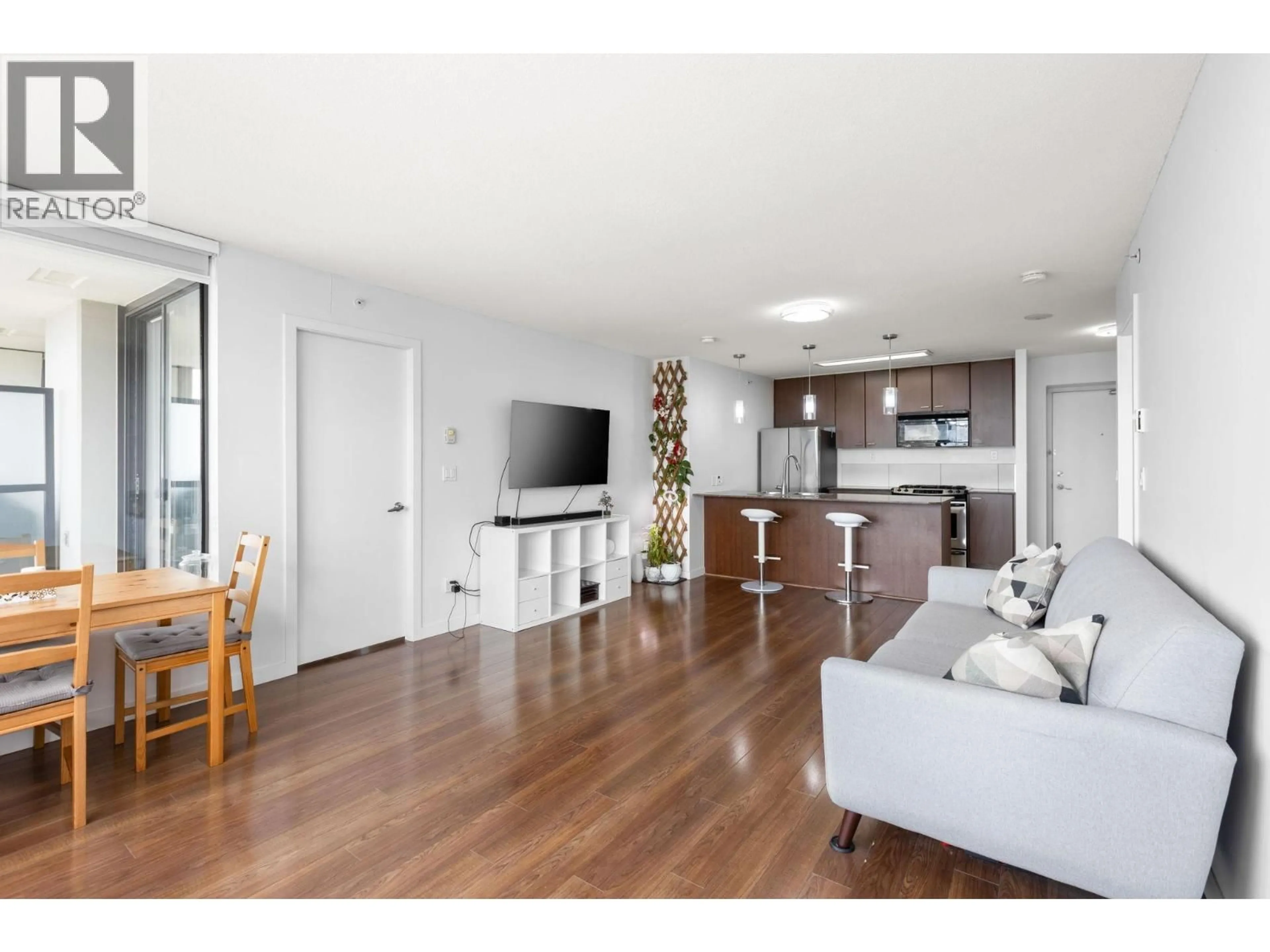 Living room with furniture, wood/laminate floor for 2705 - 7063 HALL AVENUE, Burnaby British Columbia V5E0A5