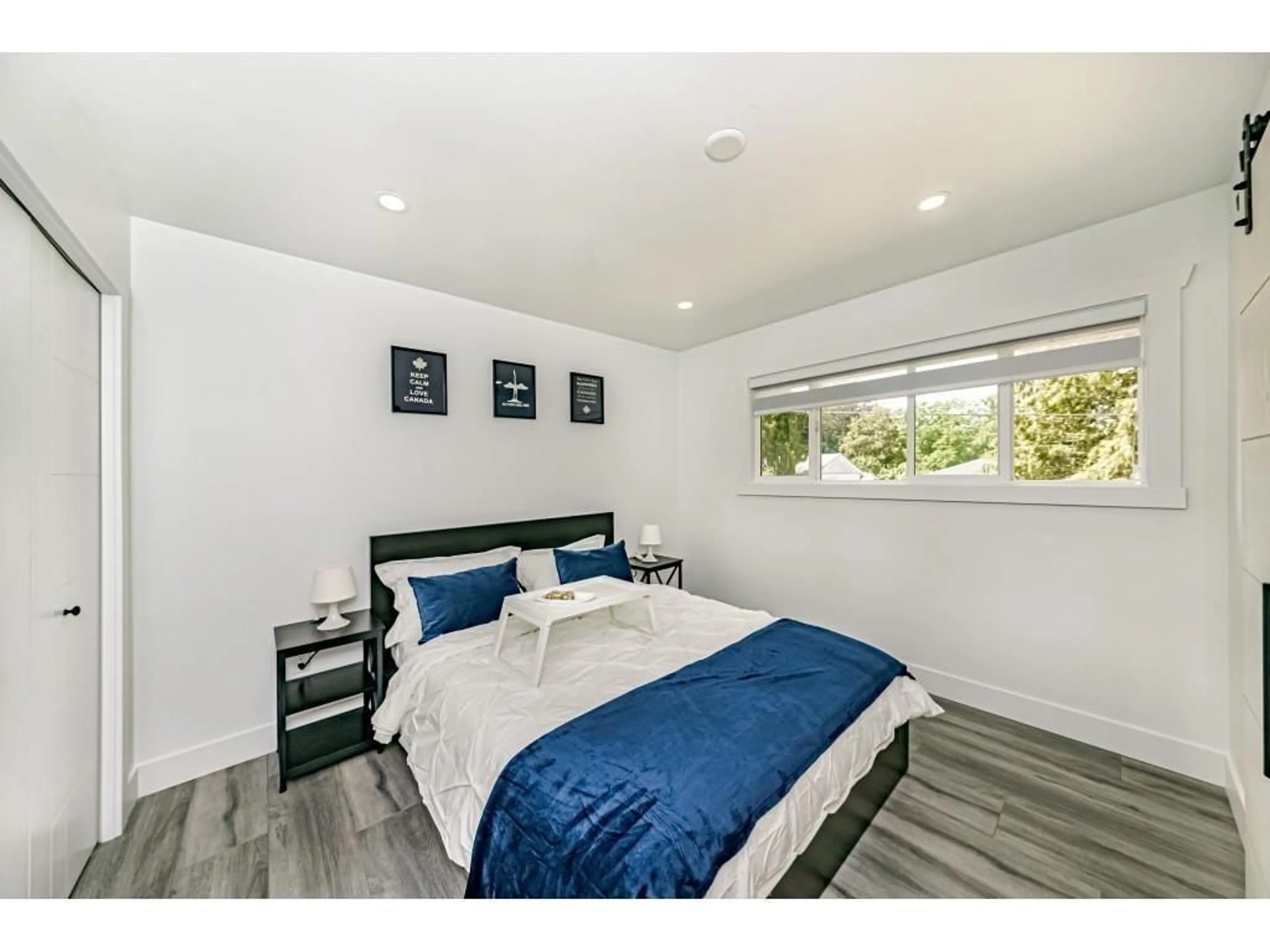 Bedroom with bed, wood/laminate floor for 14927 KEW DRIVE, Surrey British Columbia V3R4Y1
