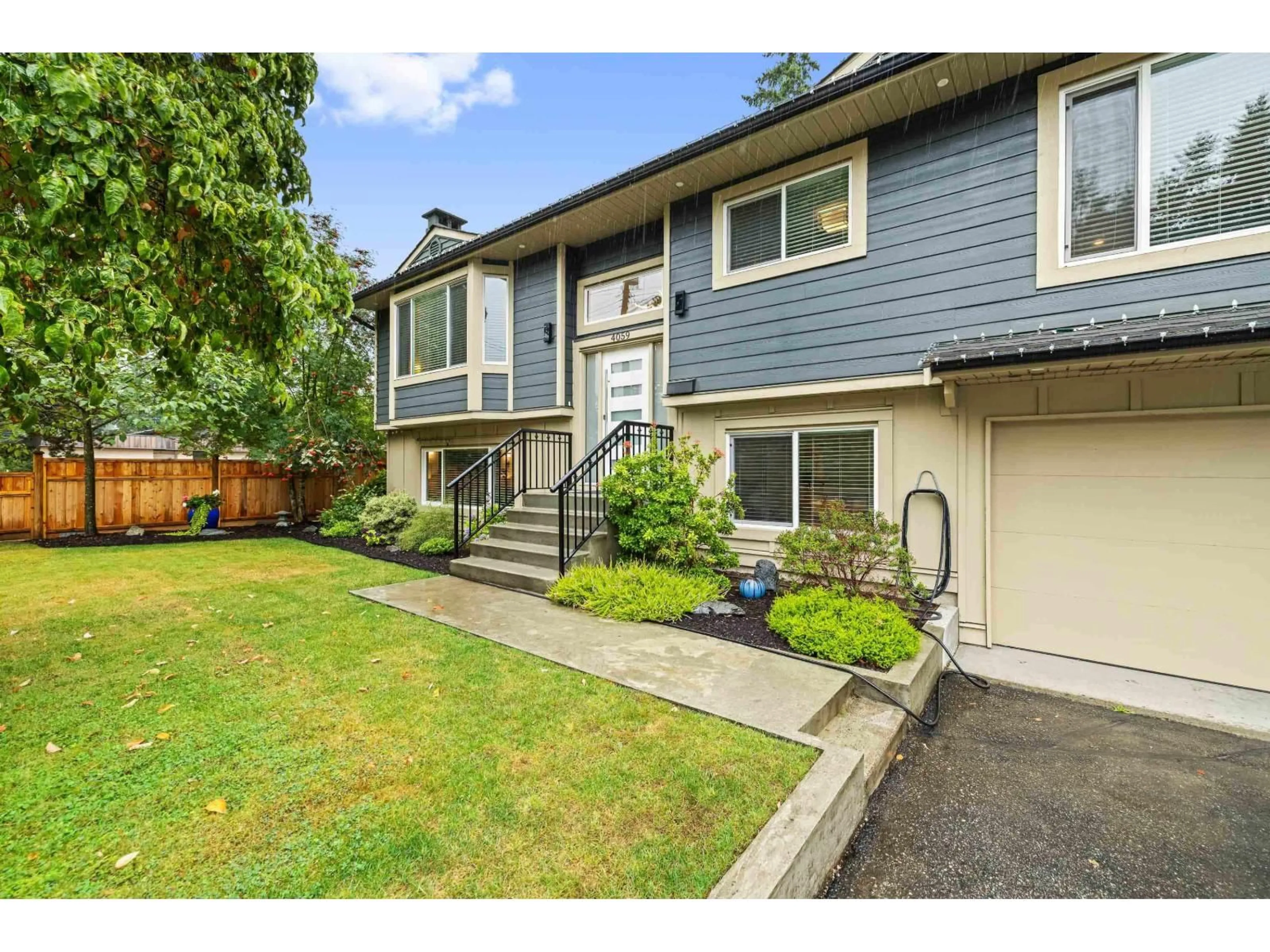 Home with vinyl exterior material, street for 4059 207, Langley British Columbia V3A2E2