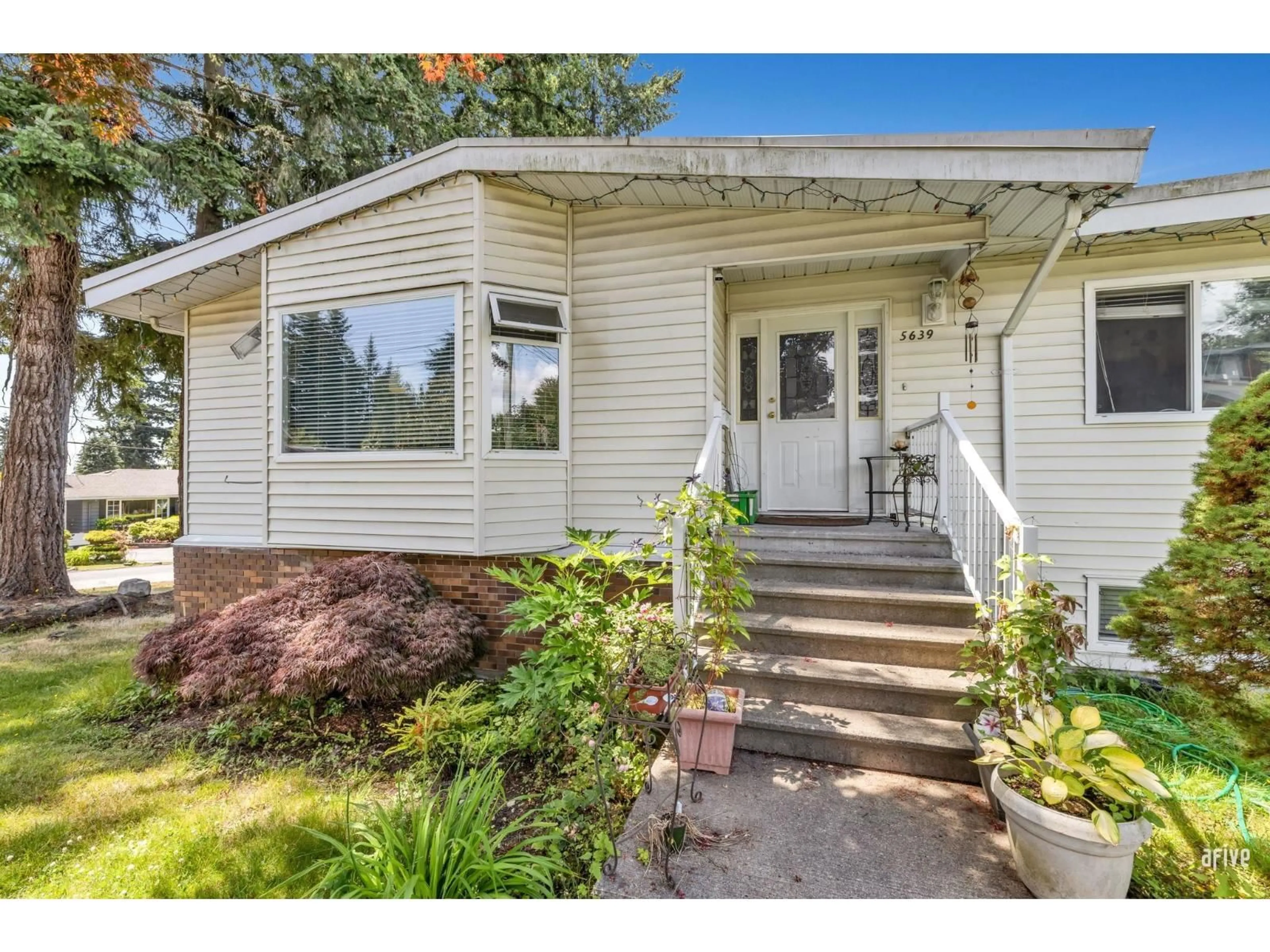 Home with vinyl exterior material, street for 5639 ABBEY, Delta British Columbia V4E1B7