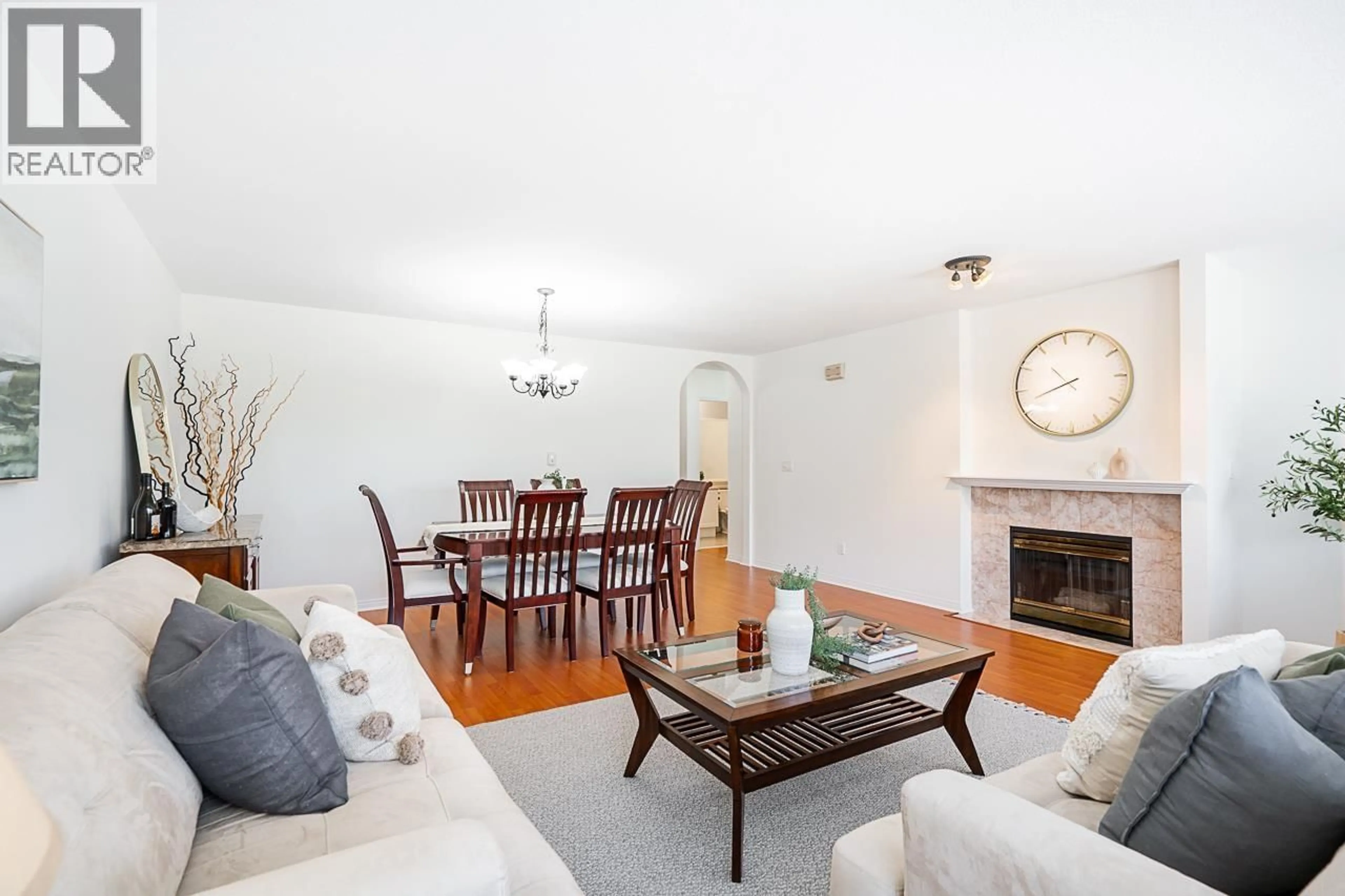 Living room with furniture, wood/laminate floor for 36 - 7465 MULBERRY PLACE, Burnaby British Columbia V3N5A1