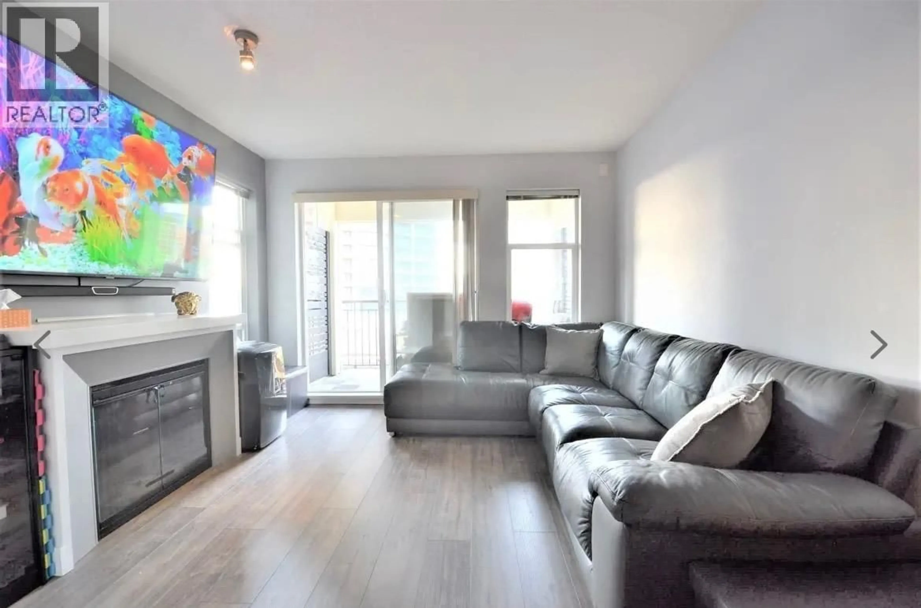 Living room with furniture, wood/laminate floor for 302 - 4868 BRENTWOOD DRIVE, Burnaby British Columbia V5C0C2
