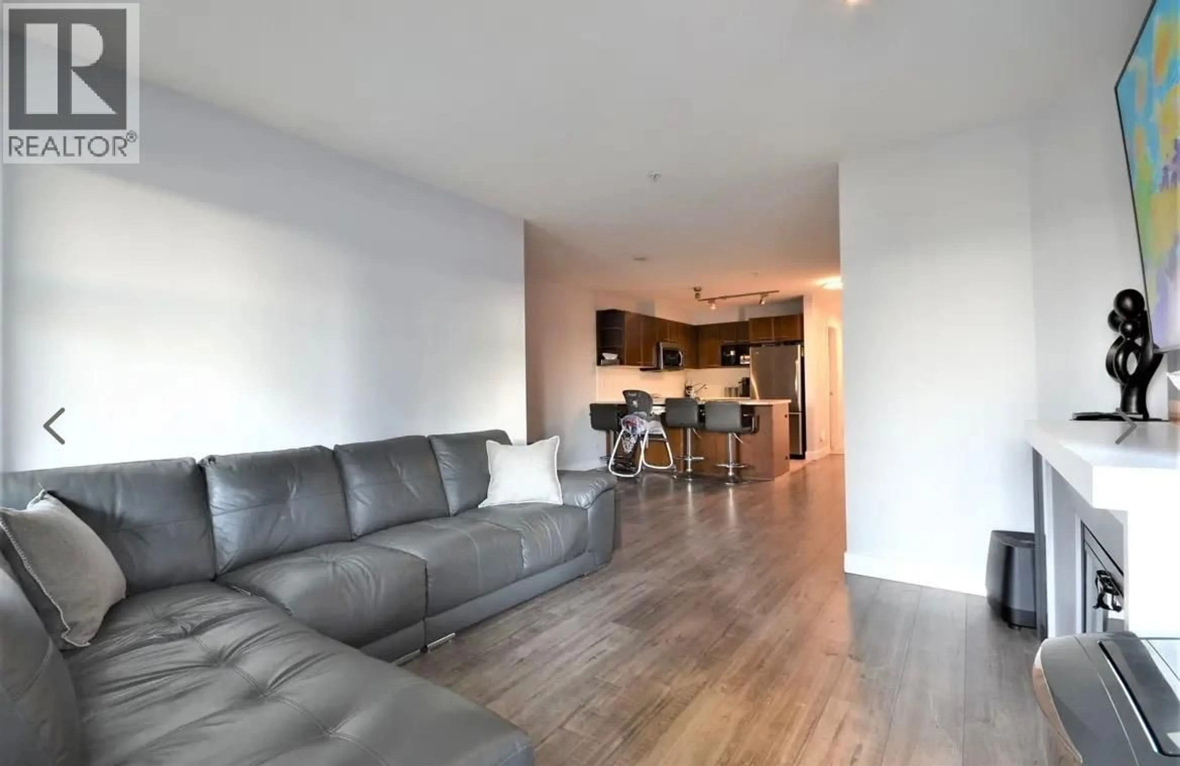 Living room with furniture, wood/laminate floor for 302 - 4868 BRENTWOOD DRIVE, Burnaby British Columbia V5C0C2