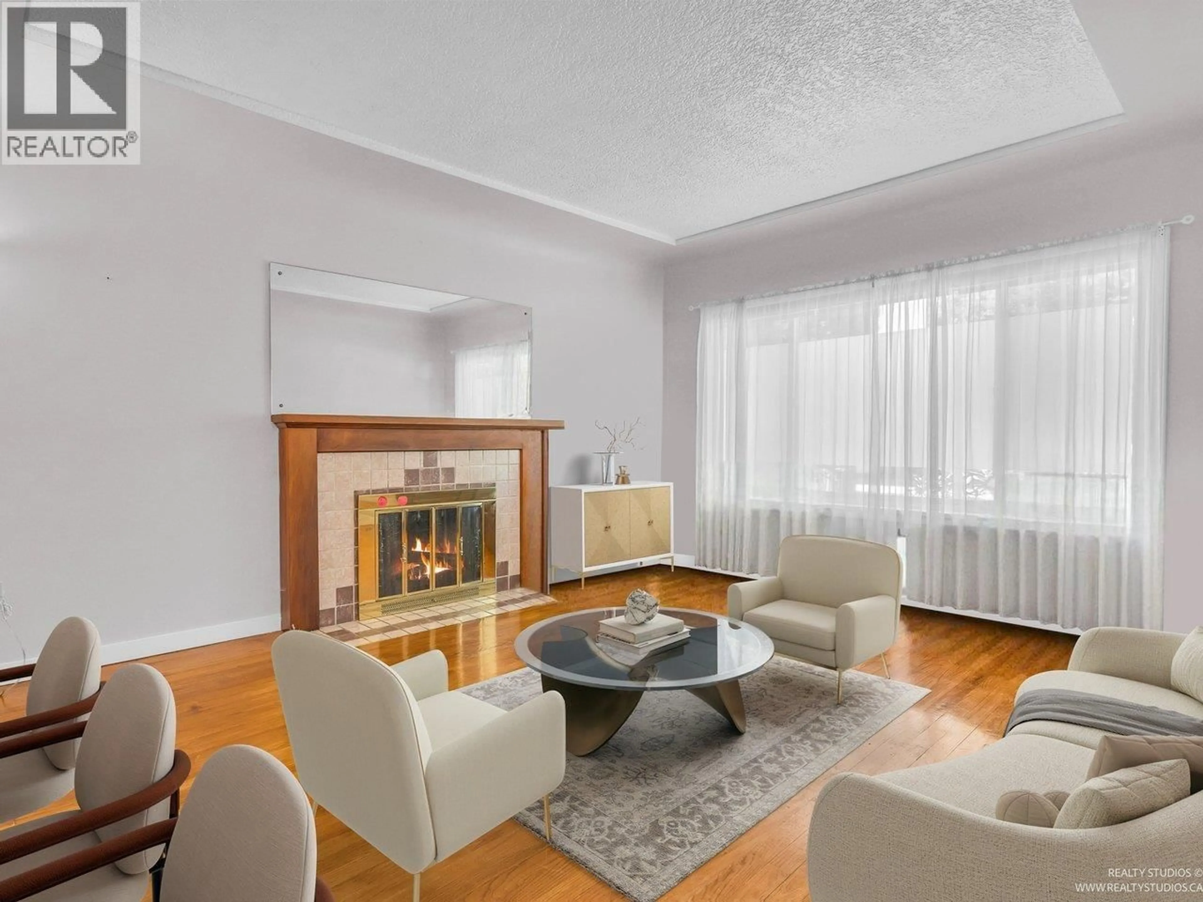 Living room with furniture, wood/laminate floor for 1032 49TH AVENUE, Vancouver British Columbia V5W2H8
