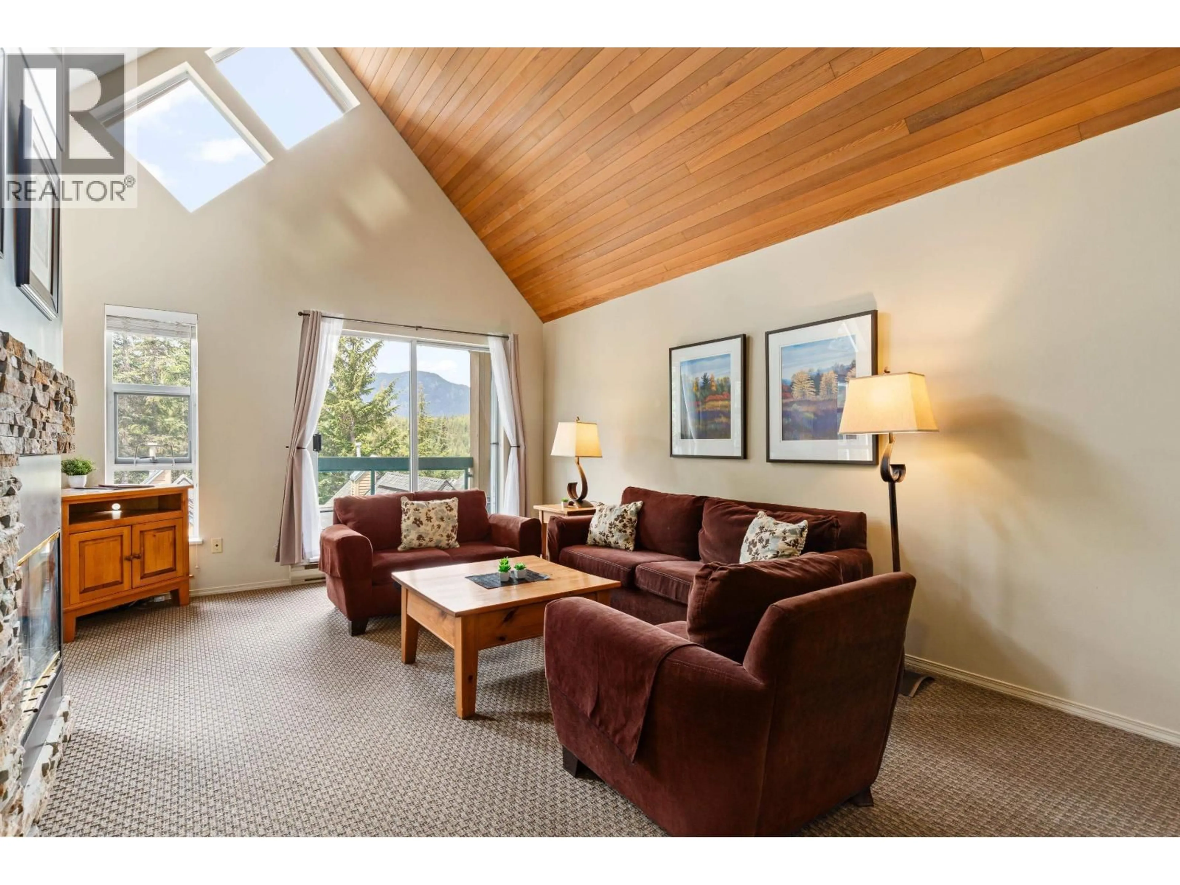 Living room with furniture, wood/laminate floor for 208 - 4865 PAINTED CLIFF ROAD, Whistler British Columbia V8E1C8