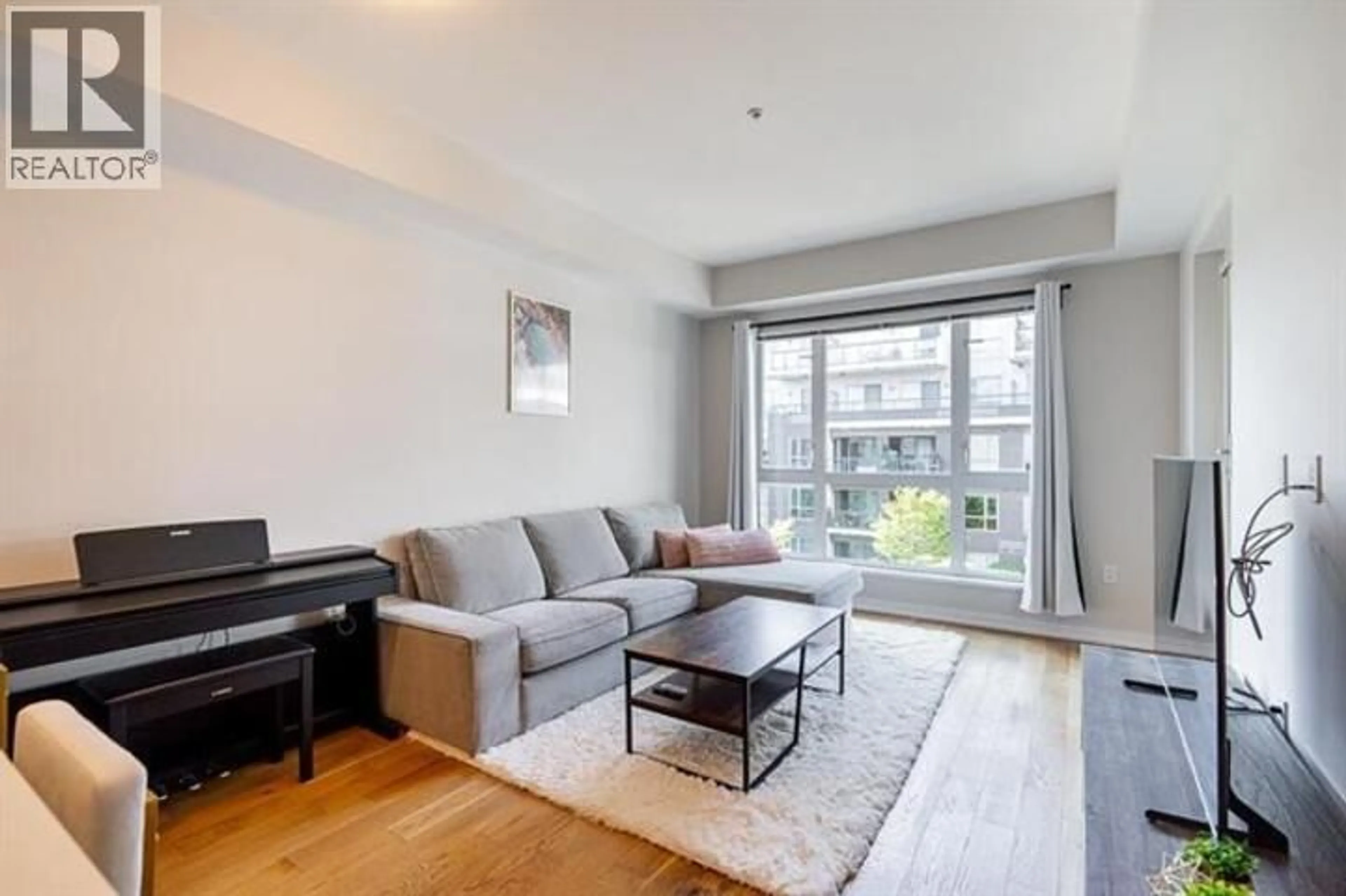 Living room with furniture, wood/laminate floor for 521 - 7008 RIVER PARKWAY, Richmond British Columbia V6X0R1