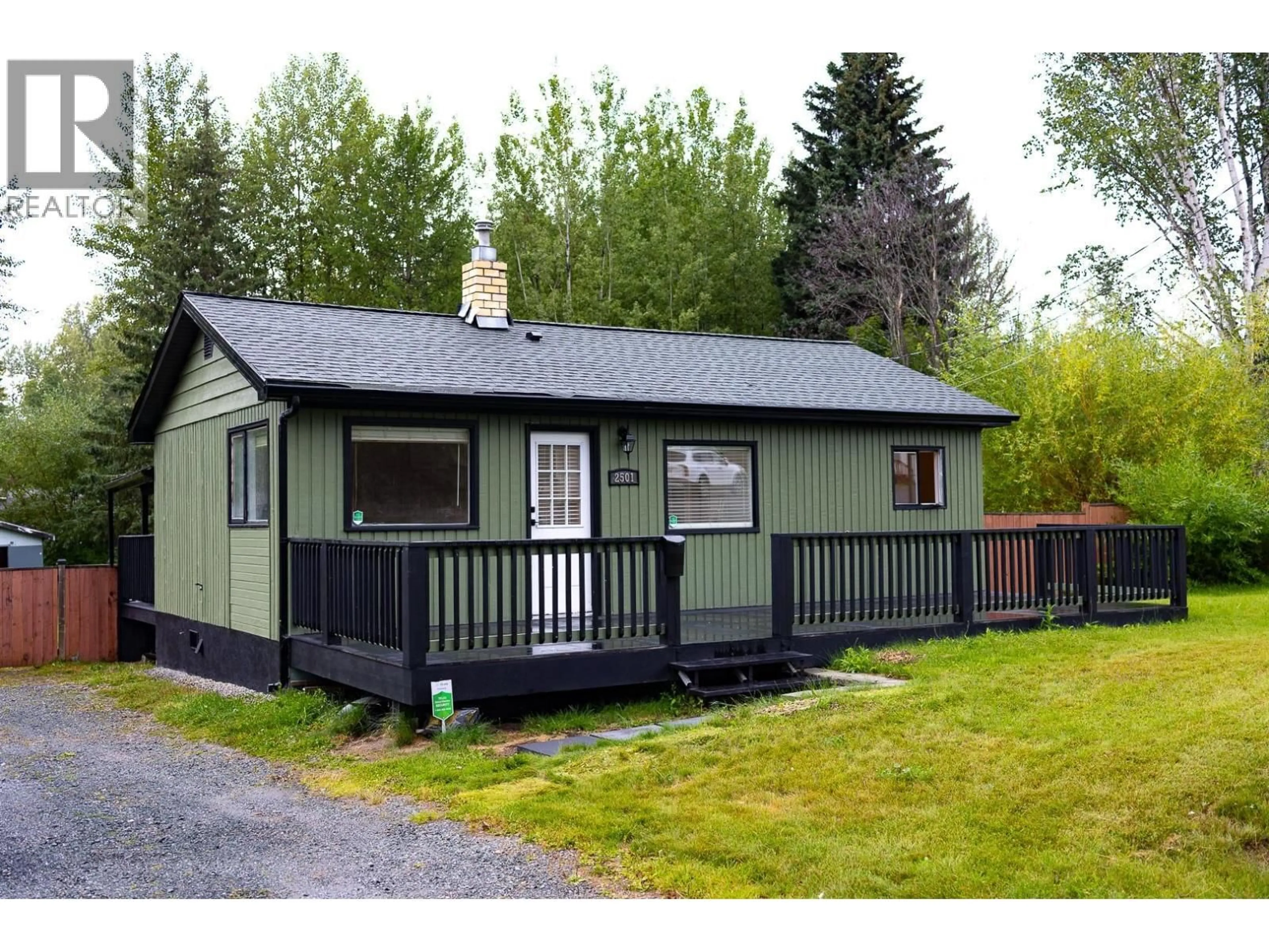 Home with vinyl exterior material, street for 2501 GRANT ROAD, Prince George British Columbia V2K1T7