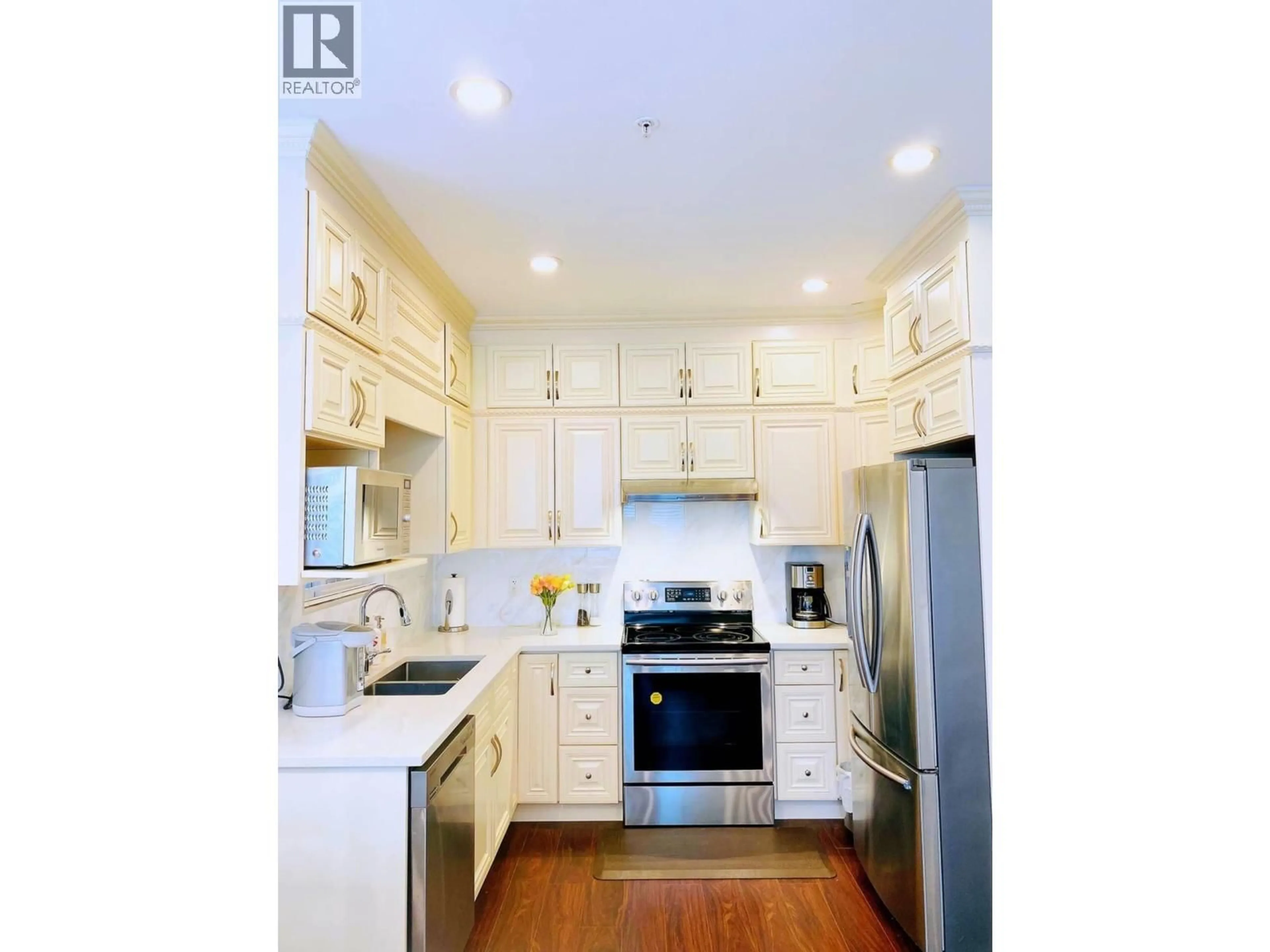 Open concept kitchen, wood/laminate floor for 6451 BEATRICE STREET, Vancouver British Columbia V5P3R5