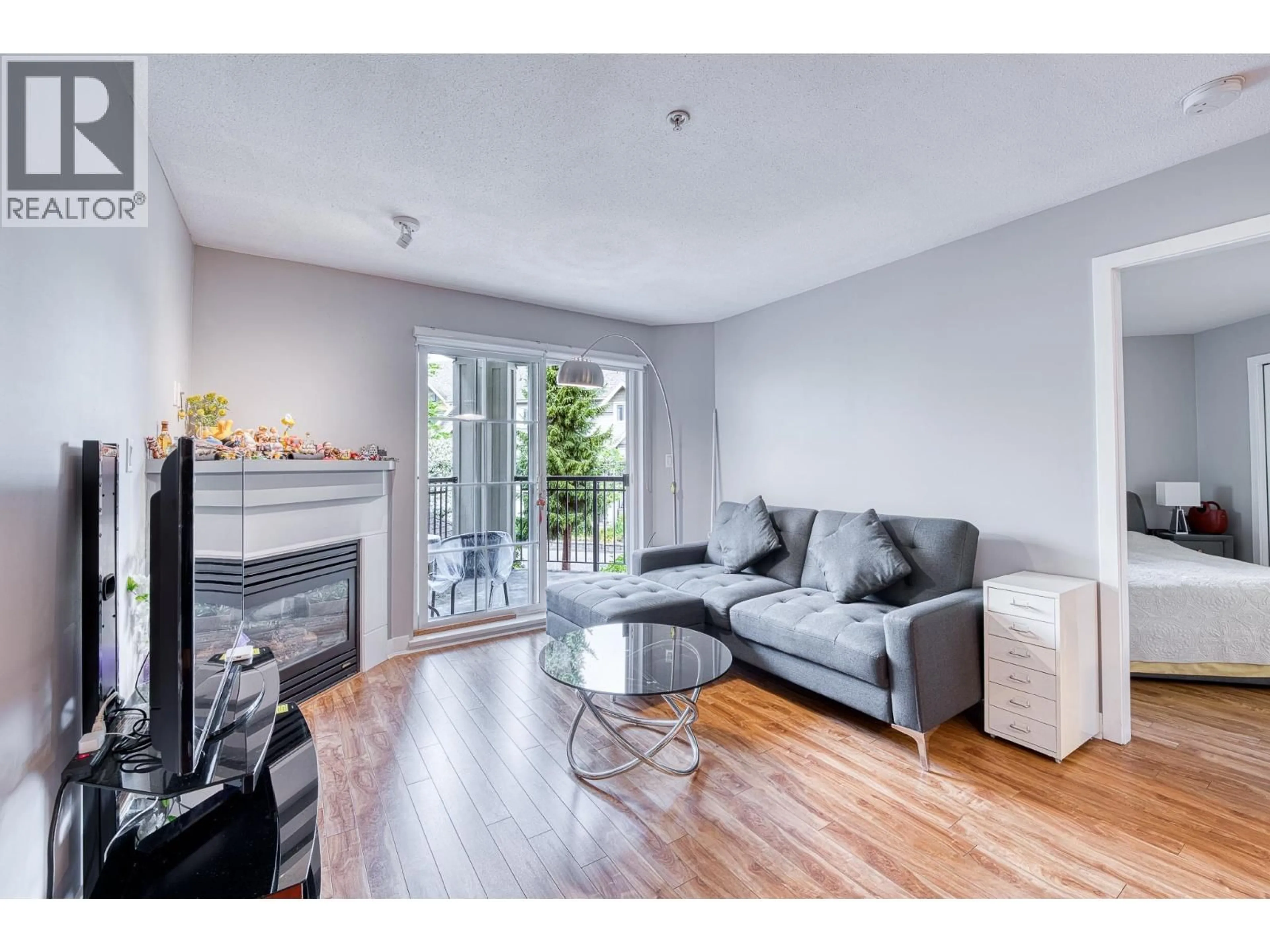 Living room with furniture, wood/laminate floor for 210 - 9333 ALBERTA ROAD, Richmond British Columbia V6Y4E4