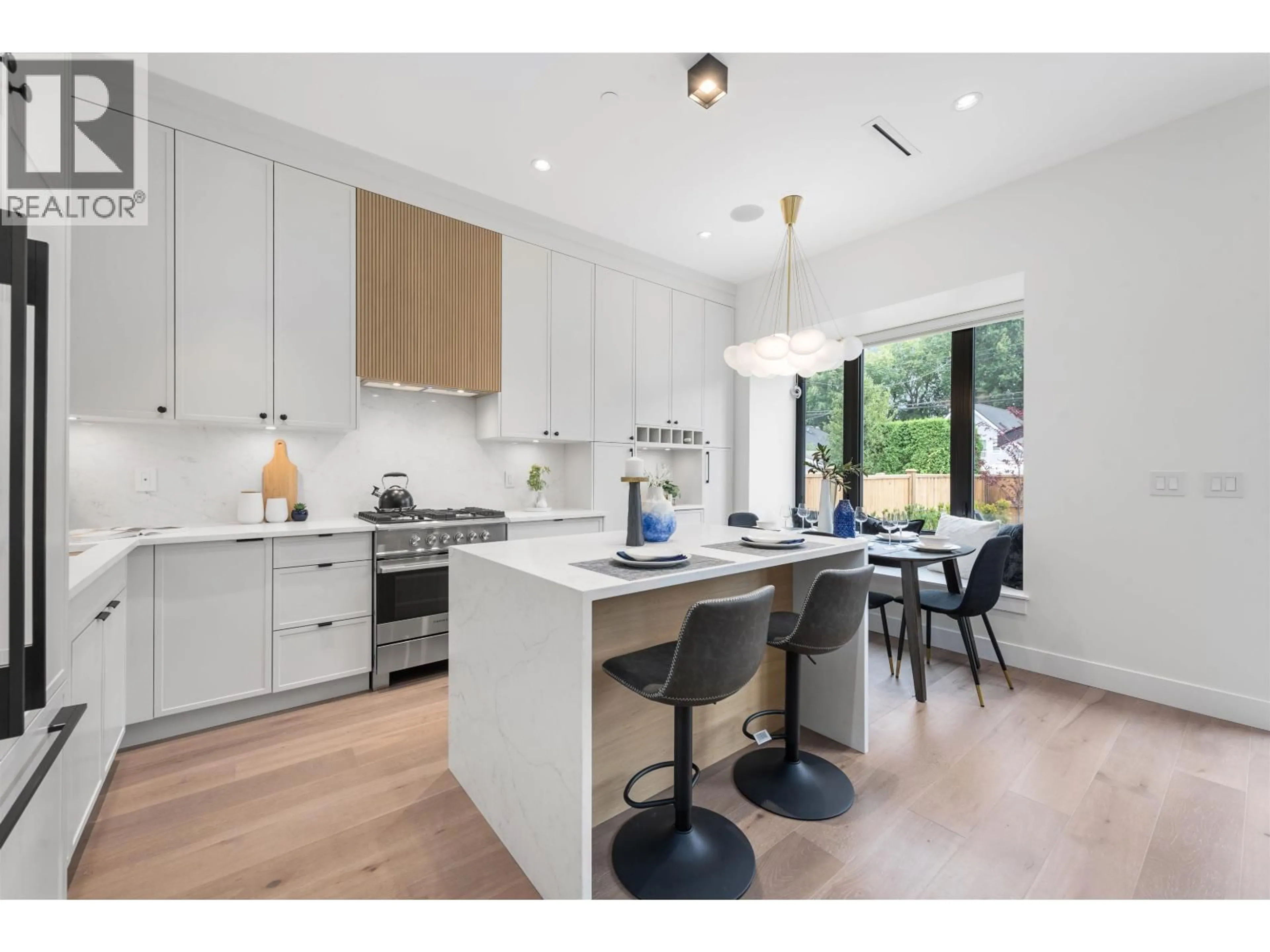 Open concept kitchen, wood/laminate floor for 2 - 878 37 AVENUE, Vancouver British Columbia V5W1G2