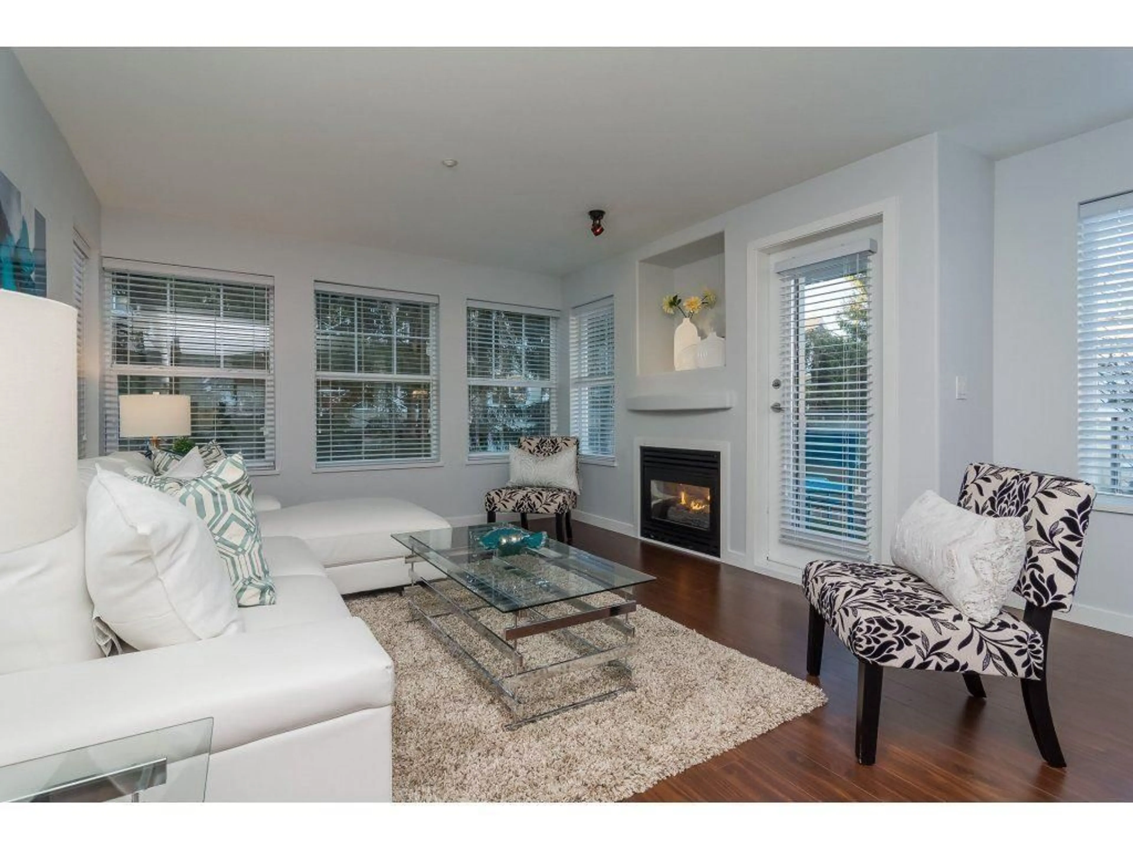 Living room with furniture, wood/laminate floor for 209 - 20200 56, Langley British Columbia V3A8S1