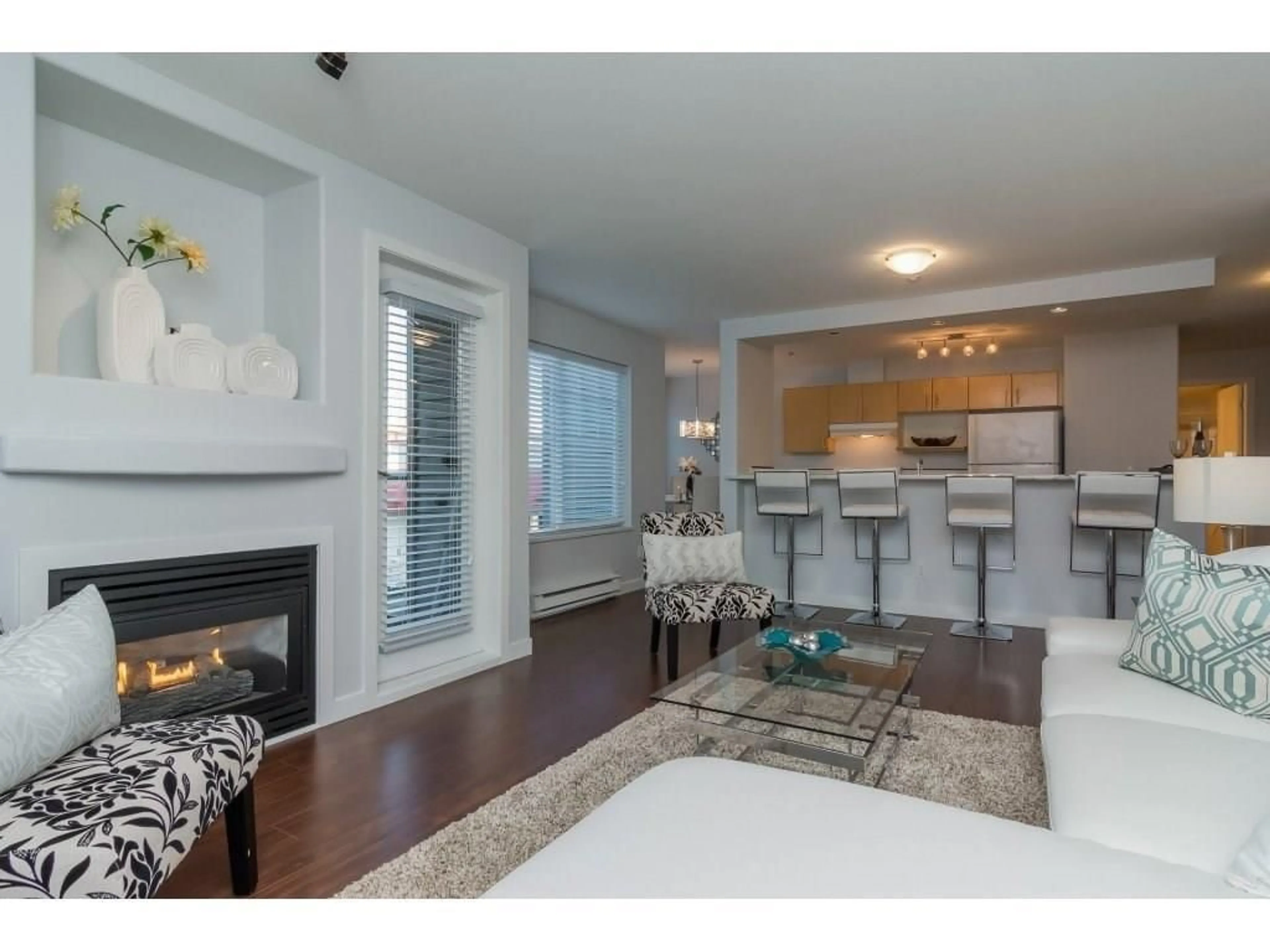 Living room with furniture, wood/laminate floor for 209 - 20200 56, Langley British Columbia V3A8S1