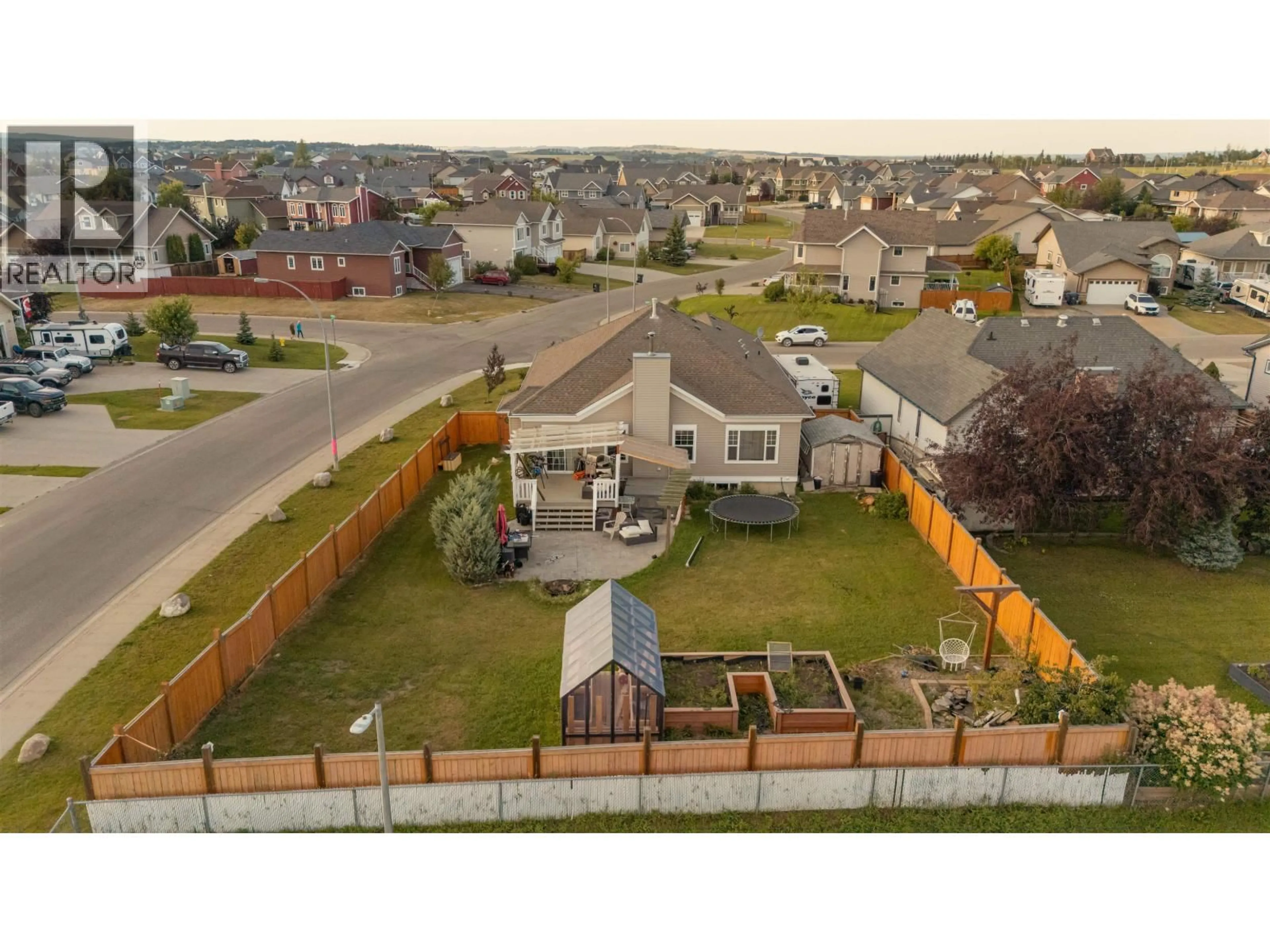 A pic from outside/outdoor area/front of a property/back of a property/a pic from drone, mountain view for 8723 109 AVENUE, Fort St. John British Columbia V1J7E6