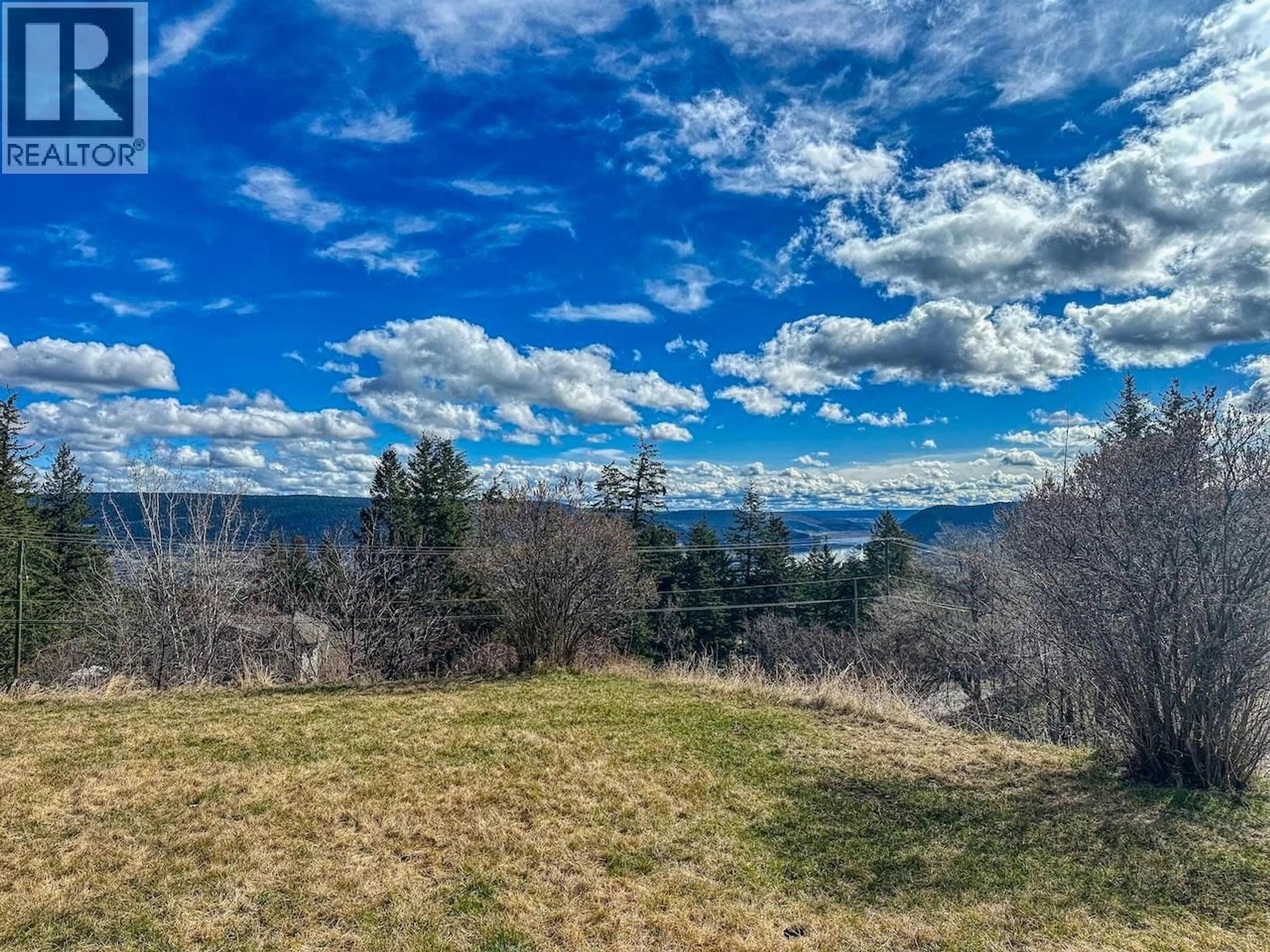 A pic from outside/outdoor area/front of a property/back of a property/a pic from drone, unknown for 66 - 803 HODGSON ROAD, Williams Lake British Columbia V2G3R2