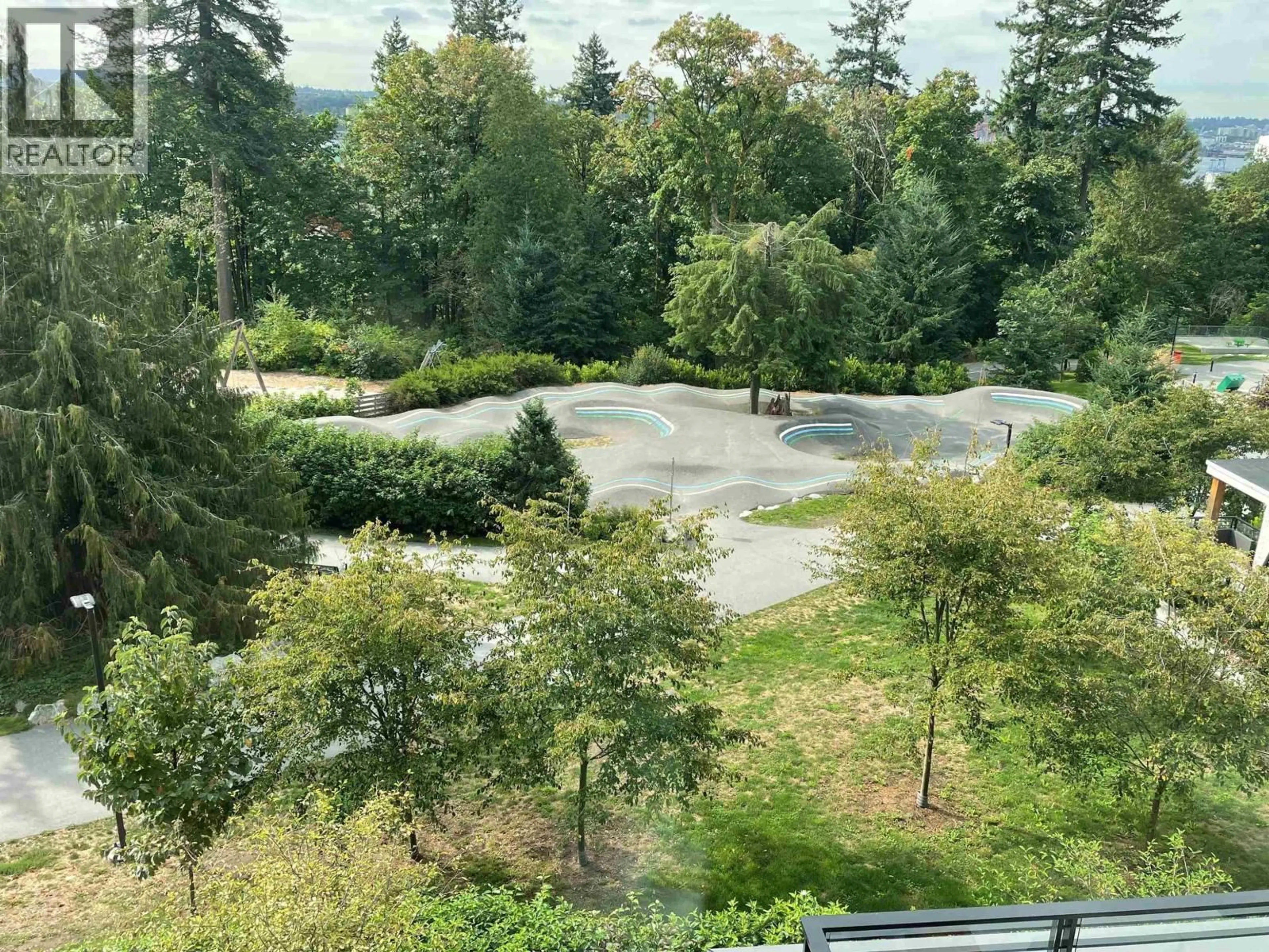 A pic from outside/outdoor area/front of a property/back of a property/a pic from drone, forest/trees view for 308 - 707 3RD STREET, North Vancouver British Columbia V7L1G8