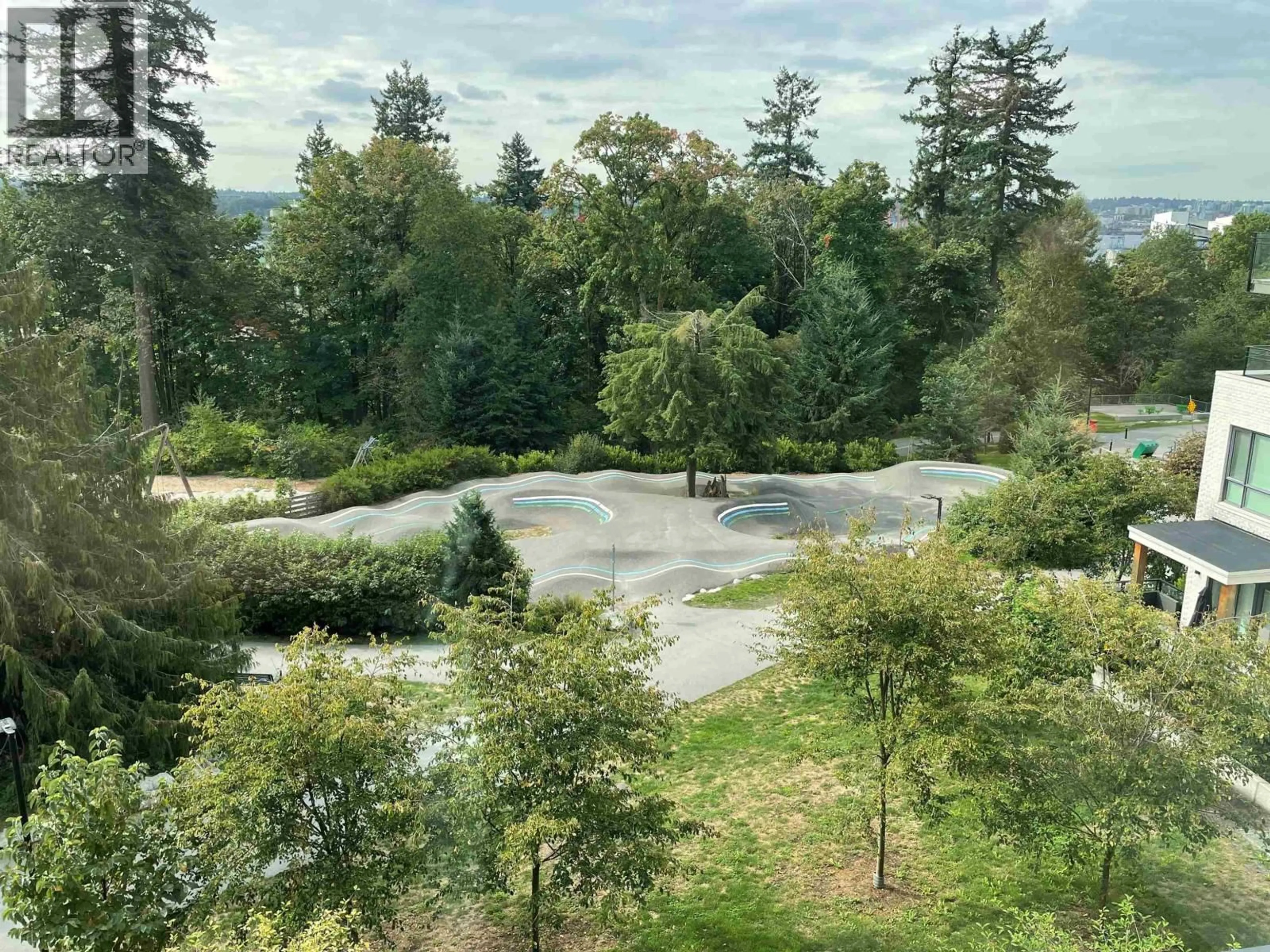 A pic from outside/outdoor area/front of a property/back of a property/a pic from drone, forest/trees view for 308 - 707 3RD STREET, North Vancouver British Columbia V7L1G8