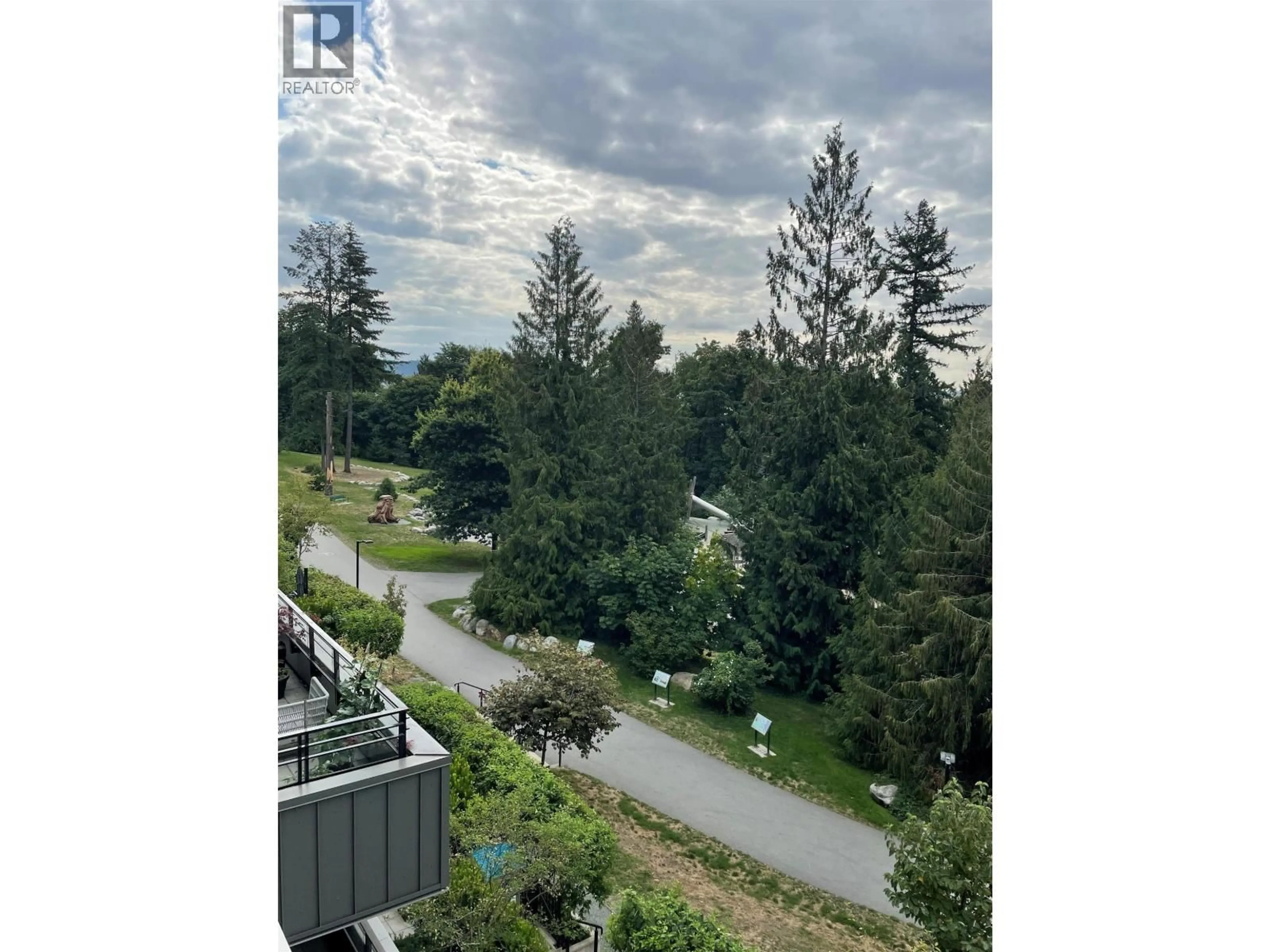 A pic from outside/outdoor area/front of a property/back of a property/a pic from drone, forest/trees view for 308 - 707 3RD STREET, North Vancouver British Columbia V7L1G8