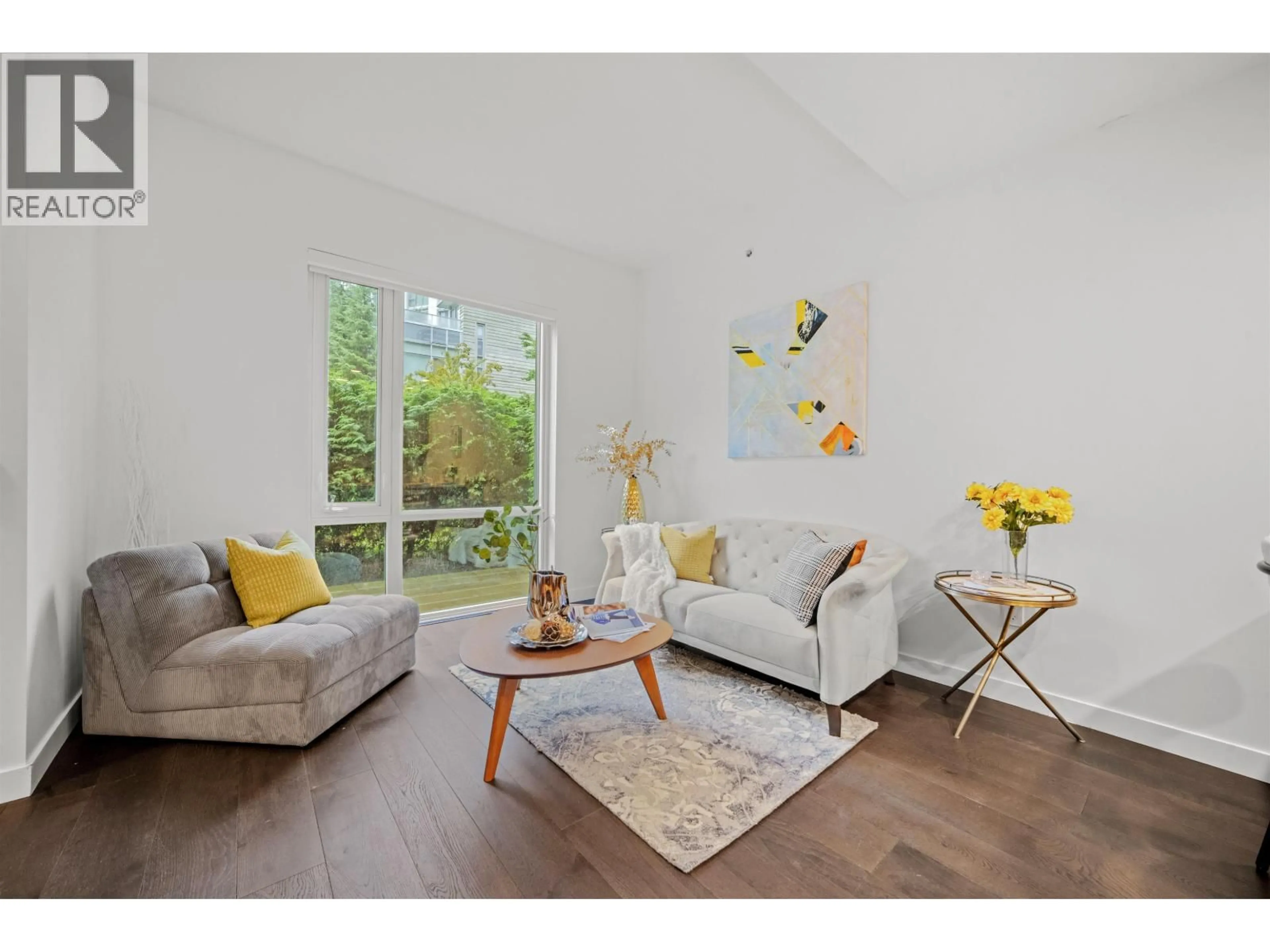Living room with furniture, wood/laminate floor for 103 - 5681 BIRNEY AVENUE, Vancouver British Columbia V6S0L5