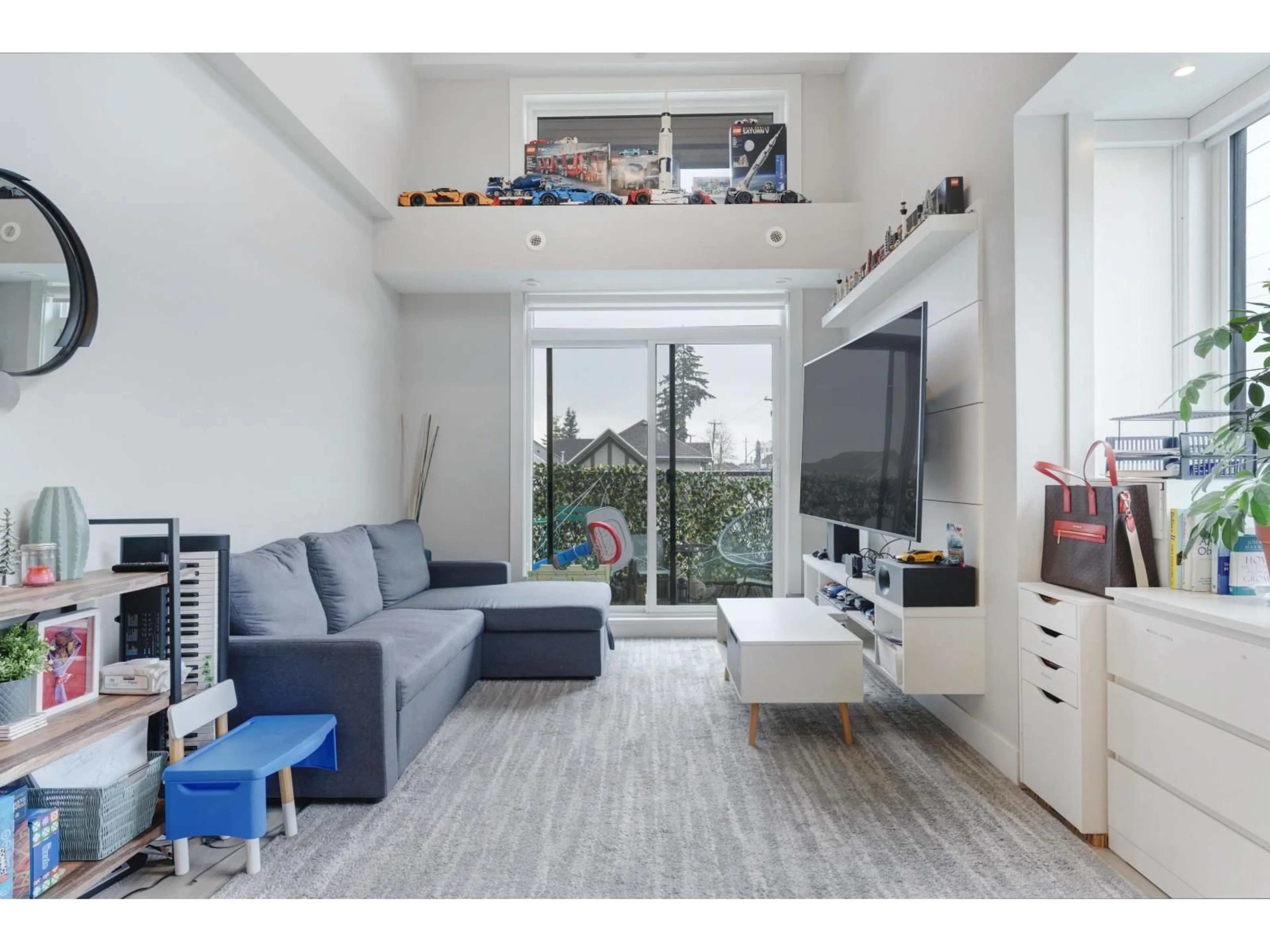 Living room with furniture, wood/laminate floor for 312 - 14818 60, Surrey British Columbia V3S0B5
