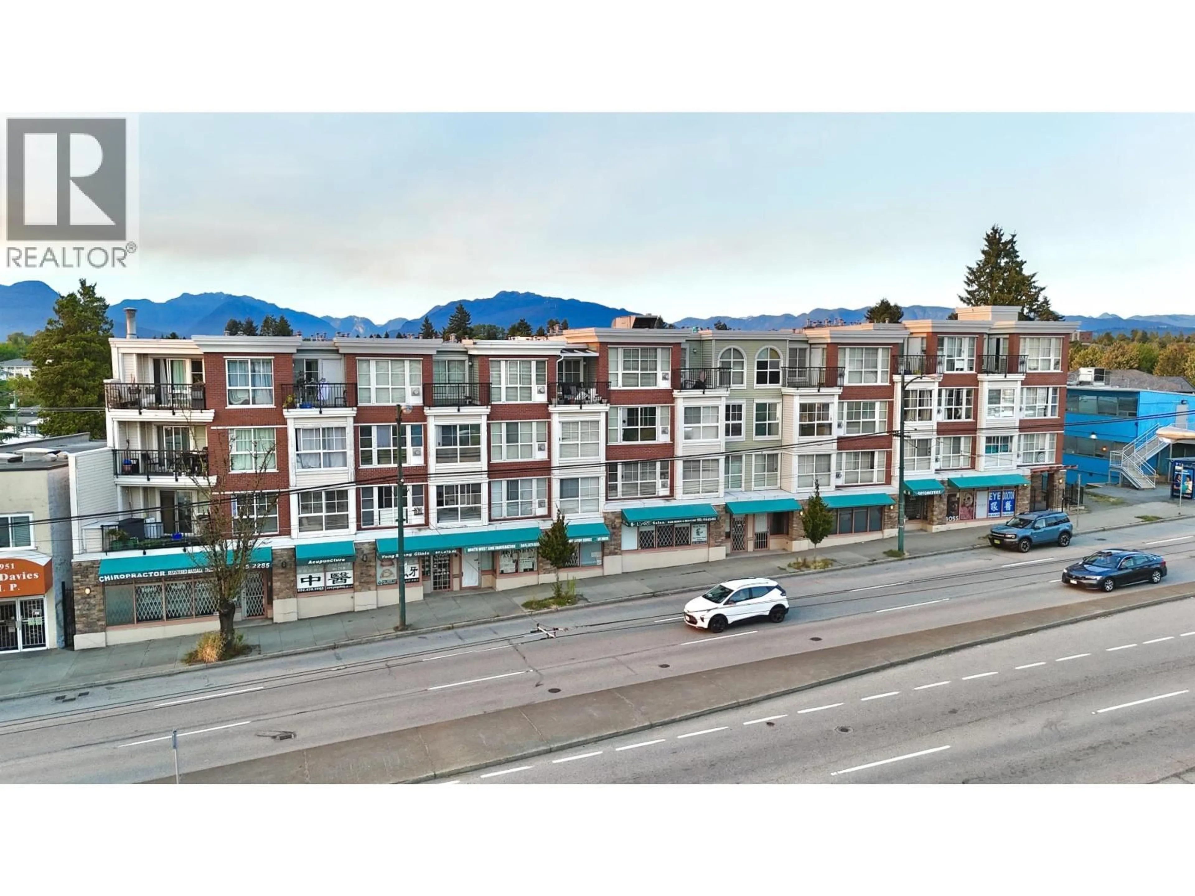 A pic from outside/outdoor area/front of a property/back of a property/a pic from drone, unknown for 102 - 2973 KINGSWAY, Vancouver British Columbia V5R5J4