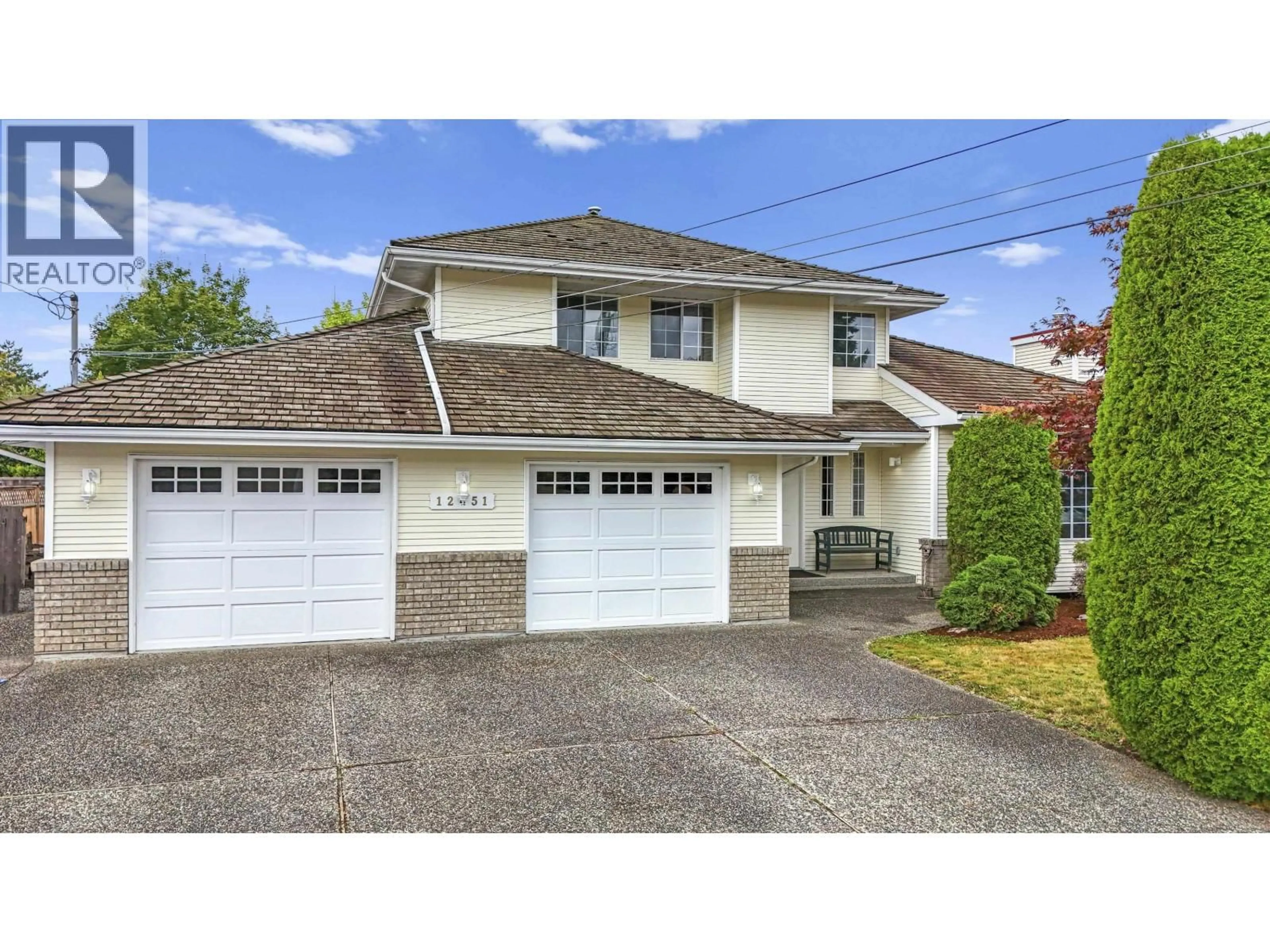 Home with vinyl exterior material, street for 12451 223 STREET, Maple Ridge British Columbia V2X5Y8