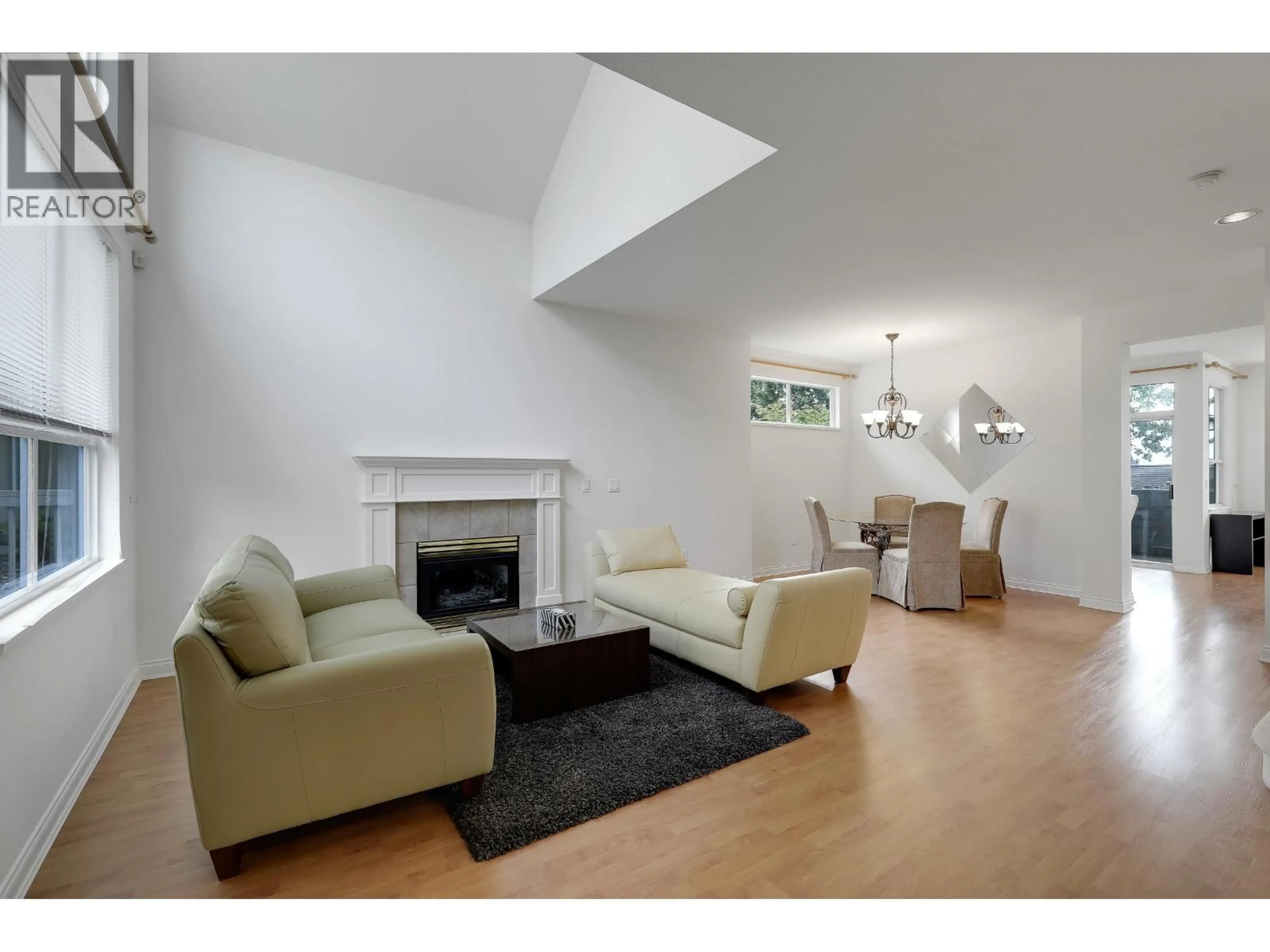 Living room with furniture, wood/laminate floor for 220 - 1465 PARKWAY BOULEVARD, Coquitlam British Columbia V3E3E6