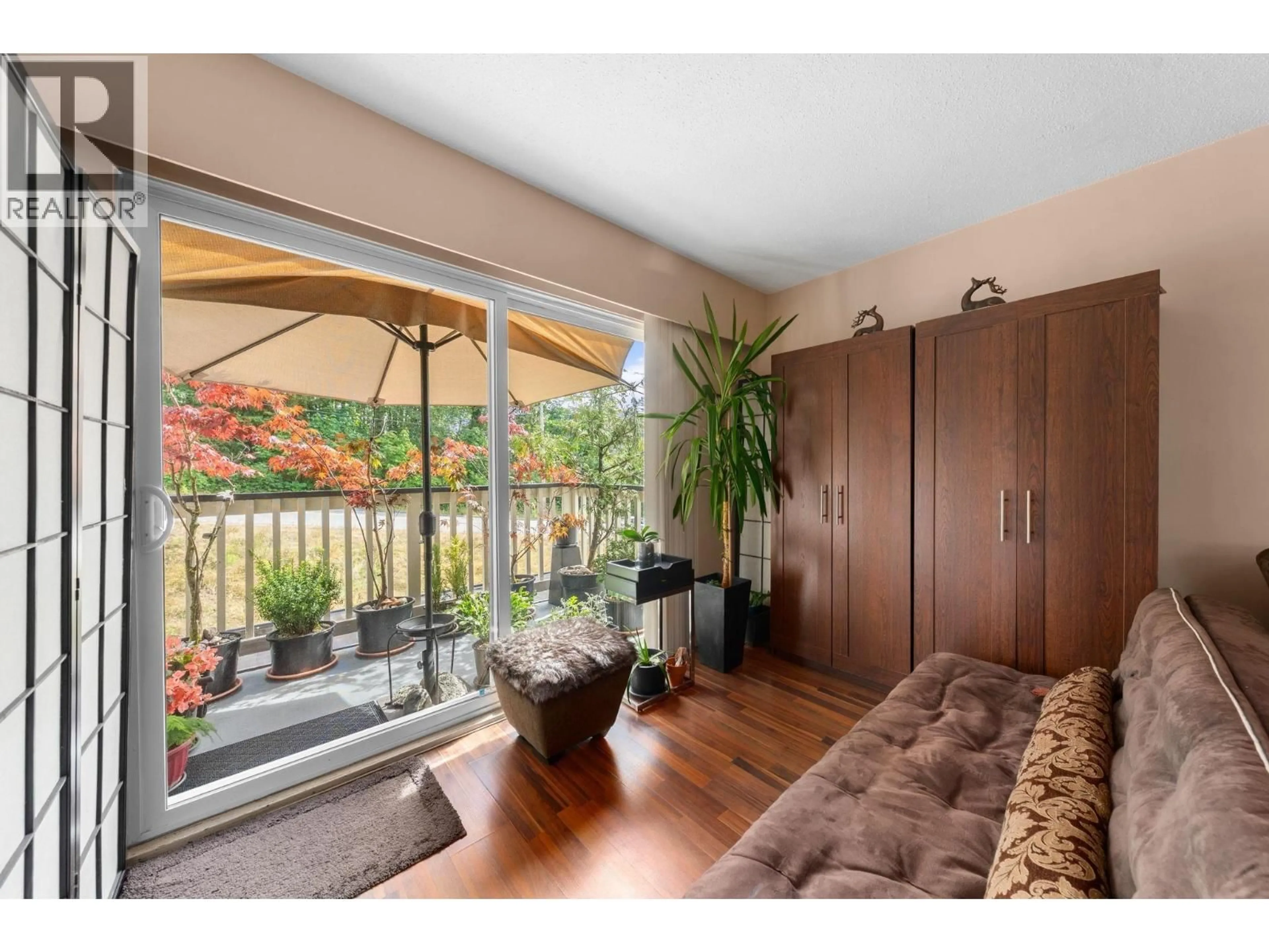 Living room with furniture, wood/laminate floor for 307 - 780 PREMIER STREET, North Vancouver British Columbia V7J2G8