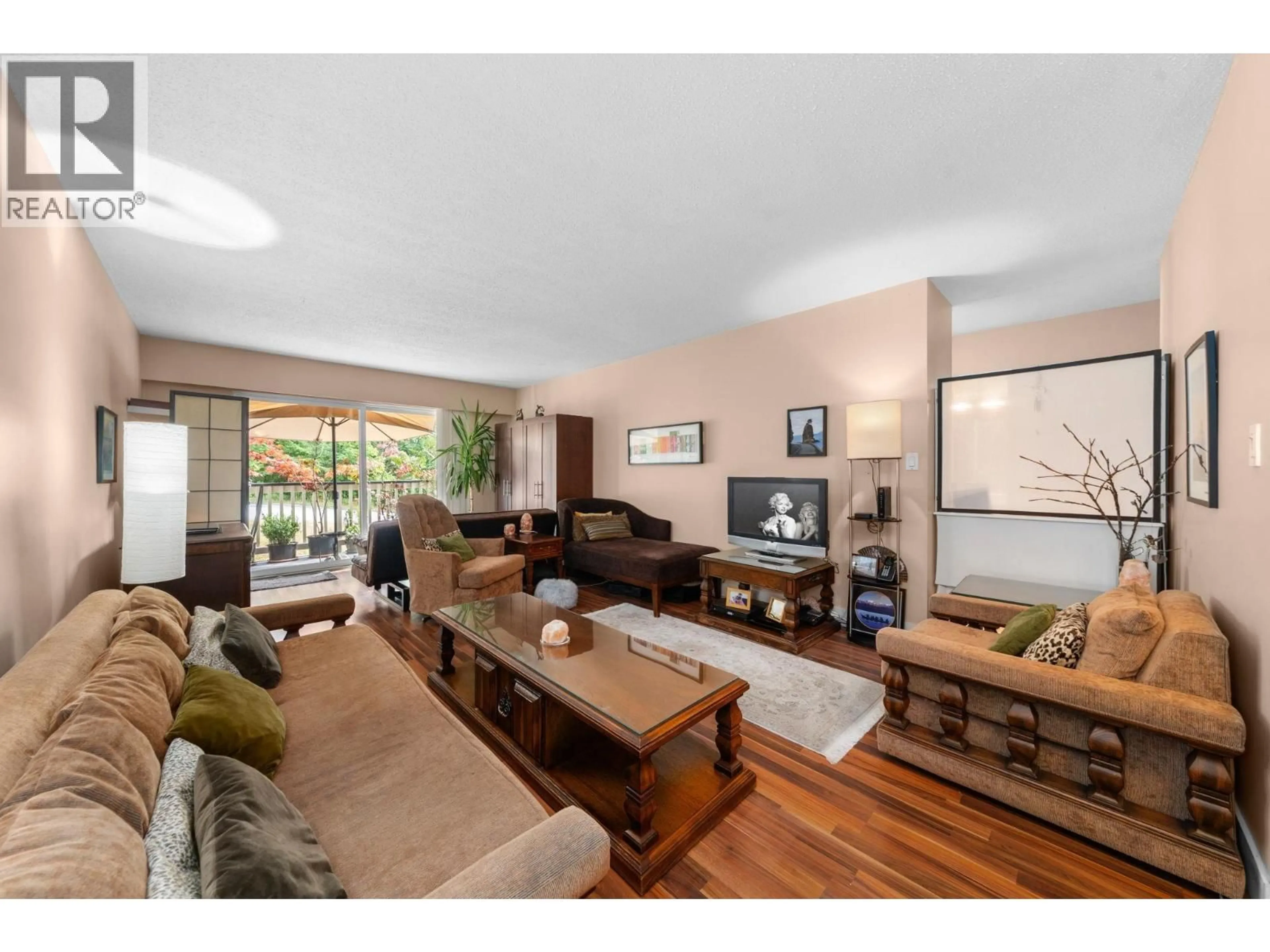 Living room with furniture, wood/laminate floor for 307 - 780 PREMIER STREET, North Vancouver British Columbia V7J2G8