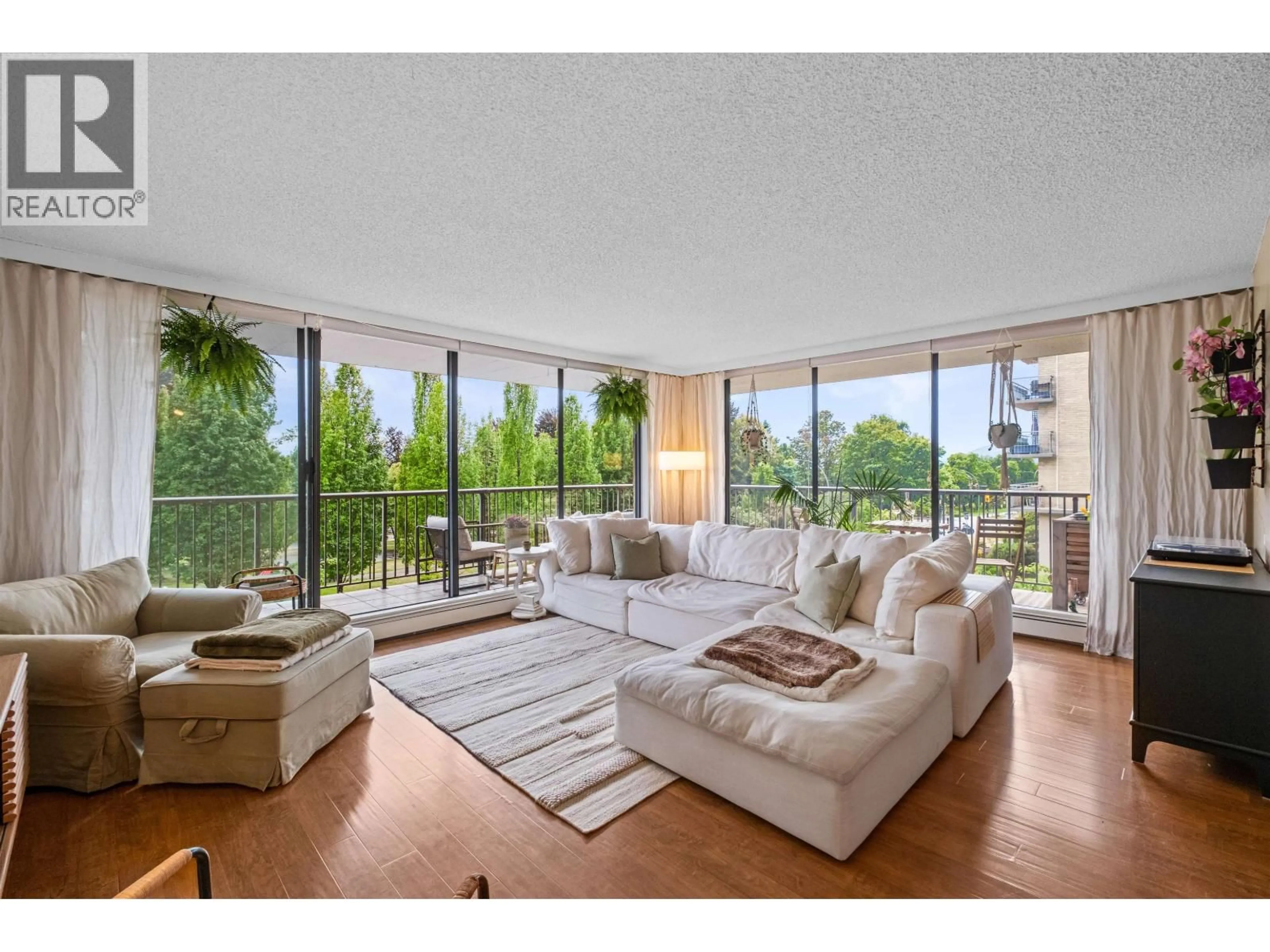 Living room with furniture, unknown for 201 - 140 KEITH ROAD, North Vancouver British Columbia V7L4M9