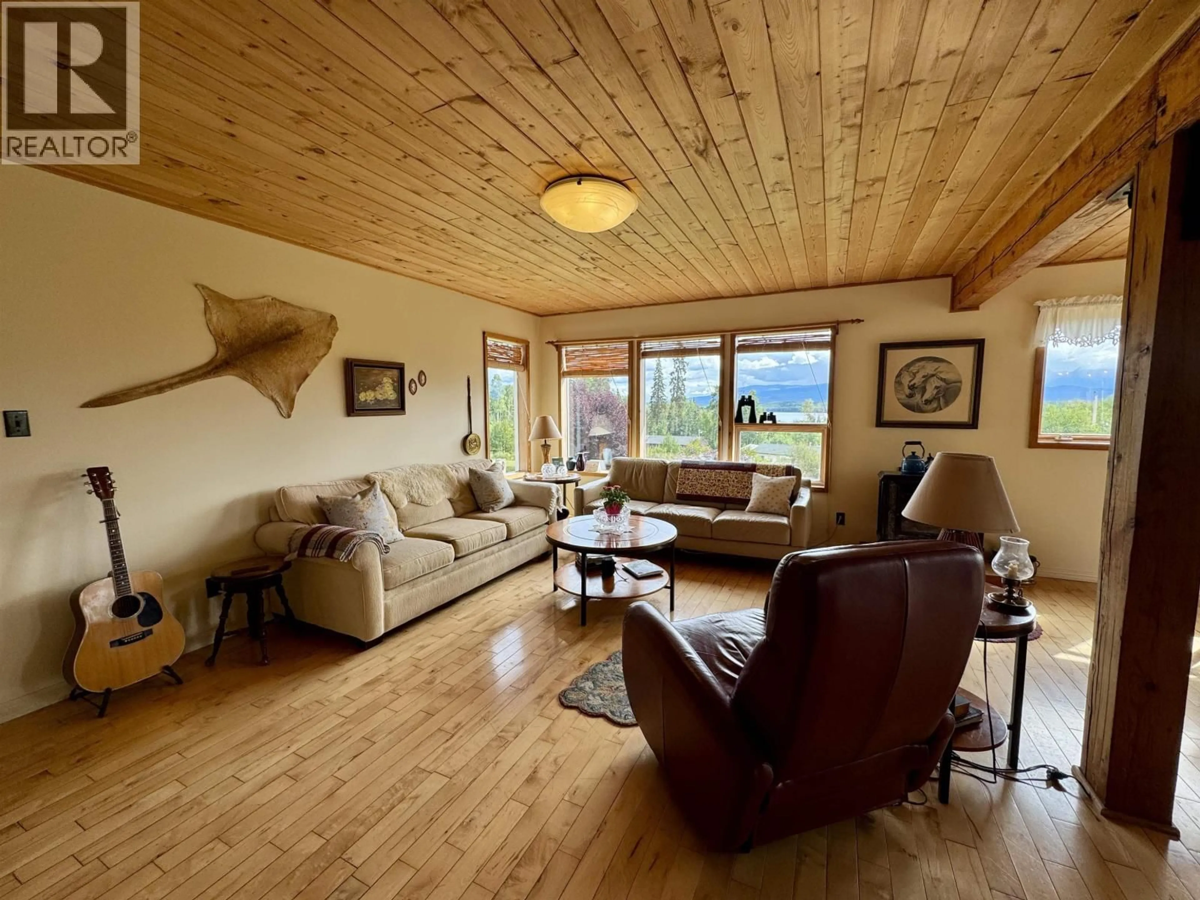 Living room with furniture, wood/laminate floor for 6496 FISHER ROAD, Telkwa British Columbia V0J2X1