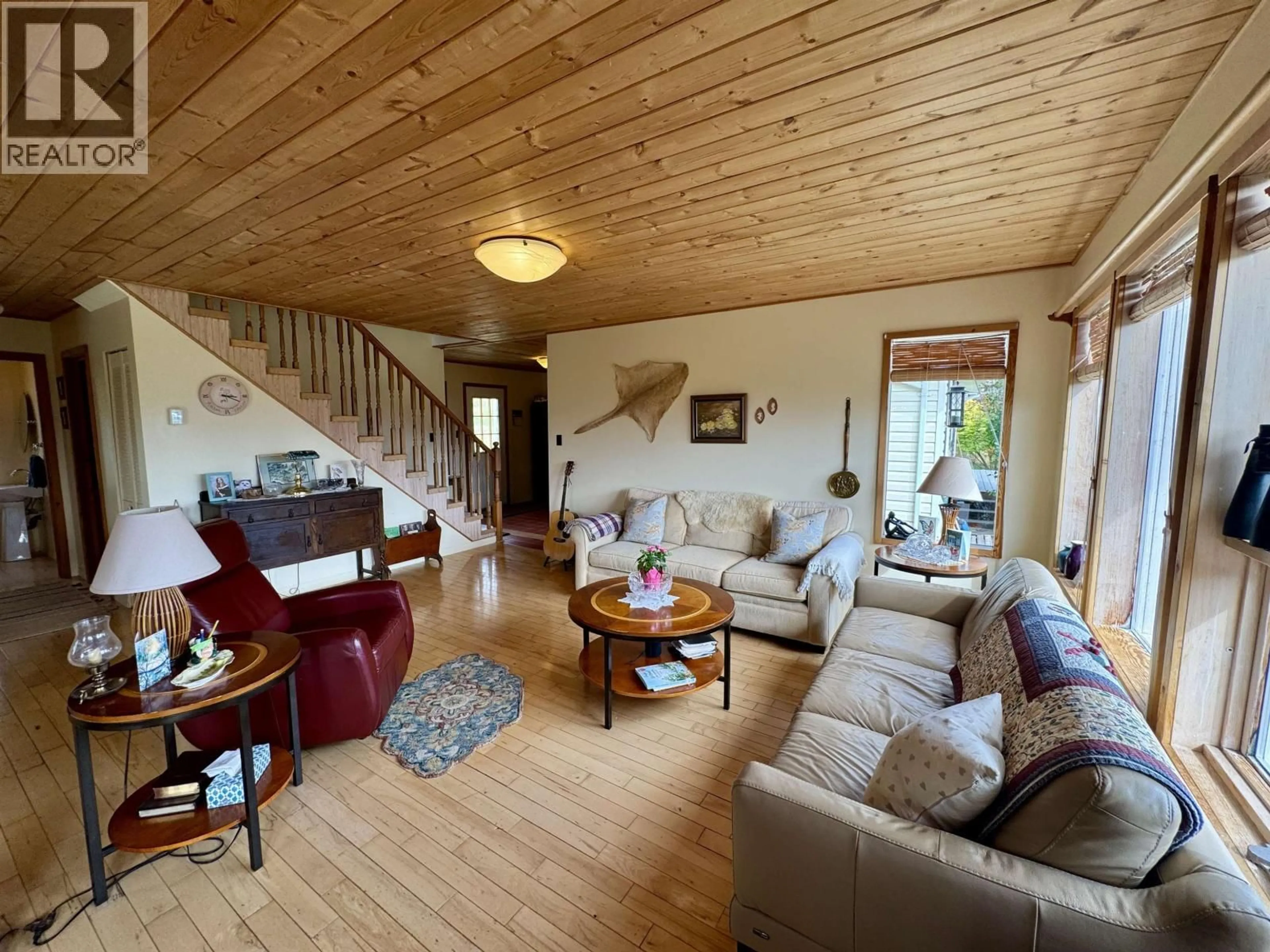 Living room with furniture, wood/laminate floor for 6496 FISHER ROAD, Telkwa British Columbia V0J2X1