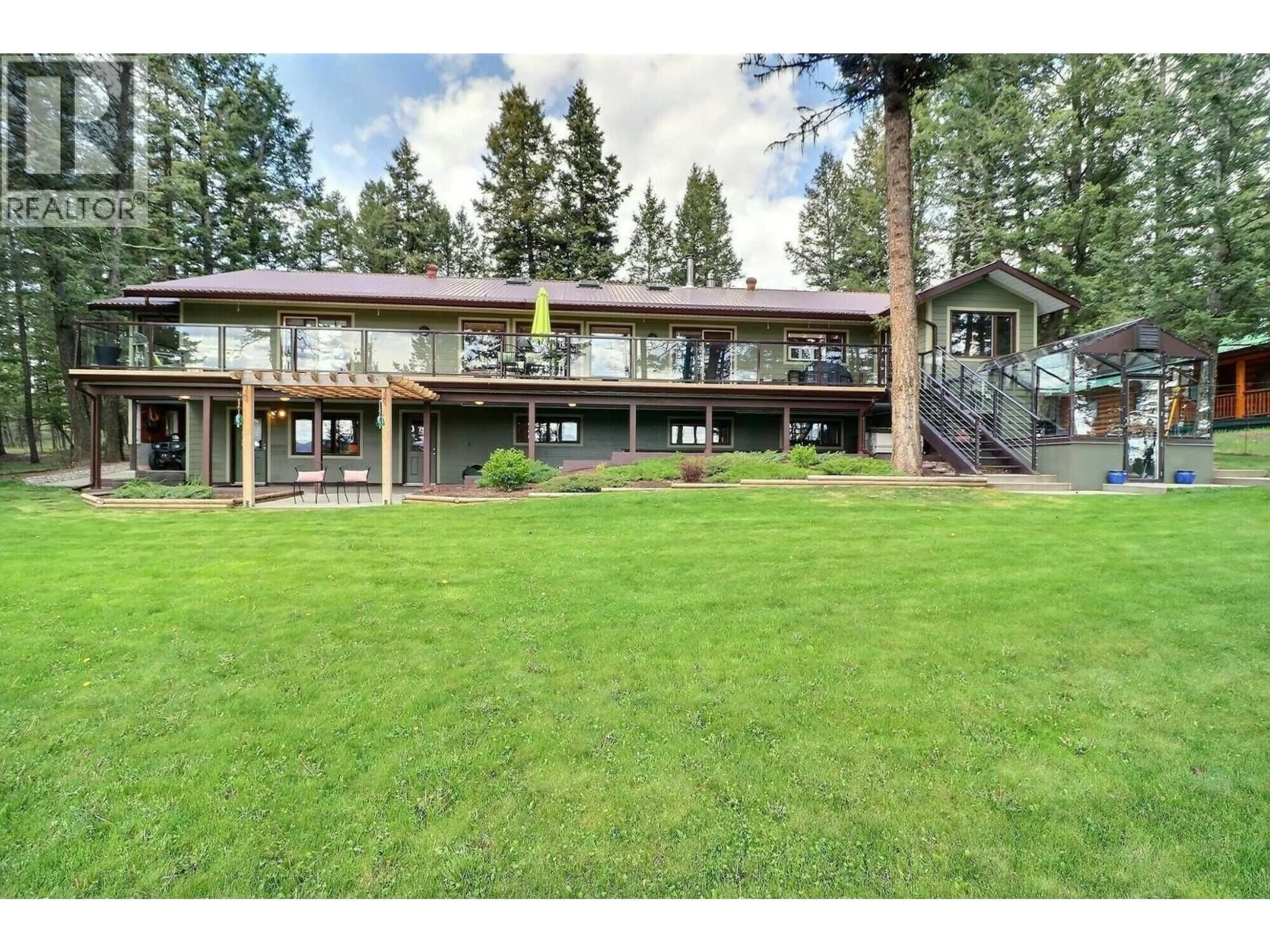 A pic from outside/outdoor area/front of a property/back of a property/a pic from drone, unknown for 5042 GLOINNZUN DRIVE, 108 Mile Ranch British Columbia V0K2Z0